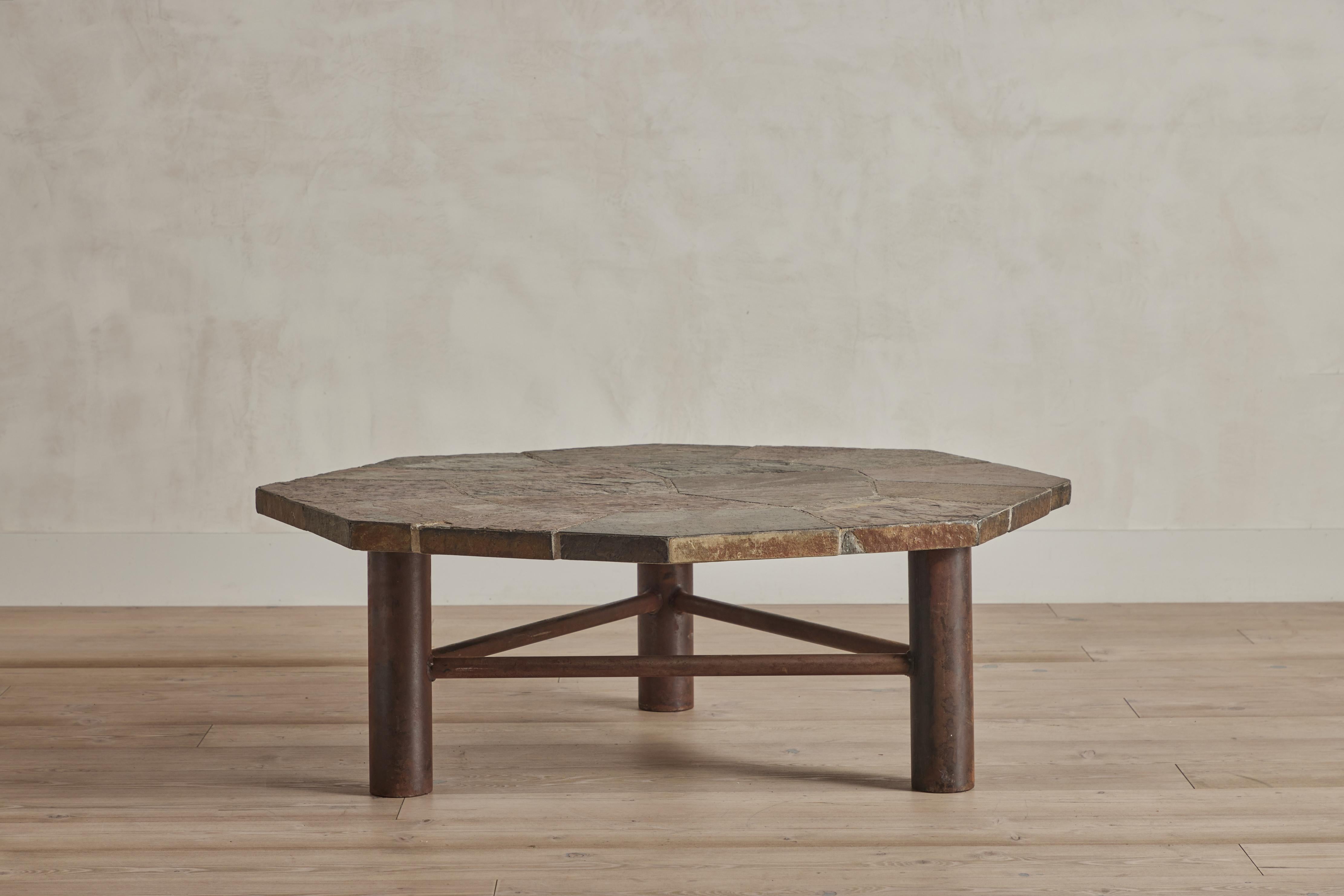 Slate coffee table with an octagonal shaped top and wood base. Scandinavia circa 1970. Wear consistent with age and use.