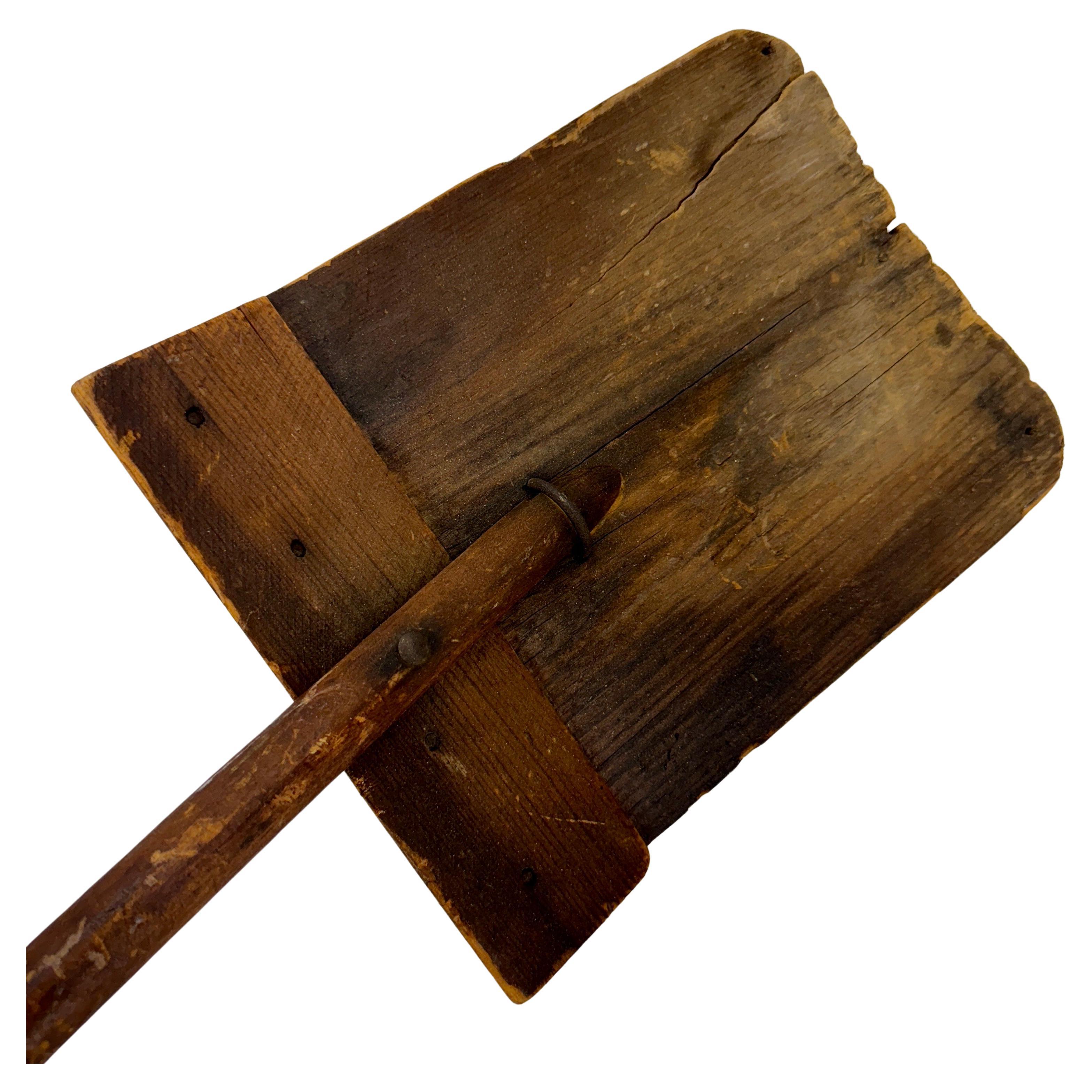 This charming folk art shovel is all wood. The patina on this 19th Century piece is incredible and would make a wonderful wall ornament. This shovel   would also be impressive added to an existing collection of similar pieces. 