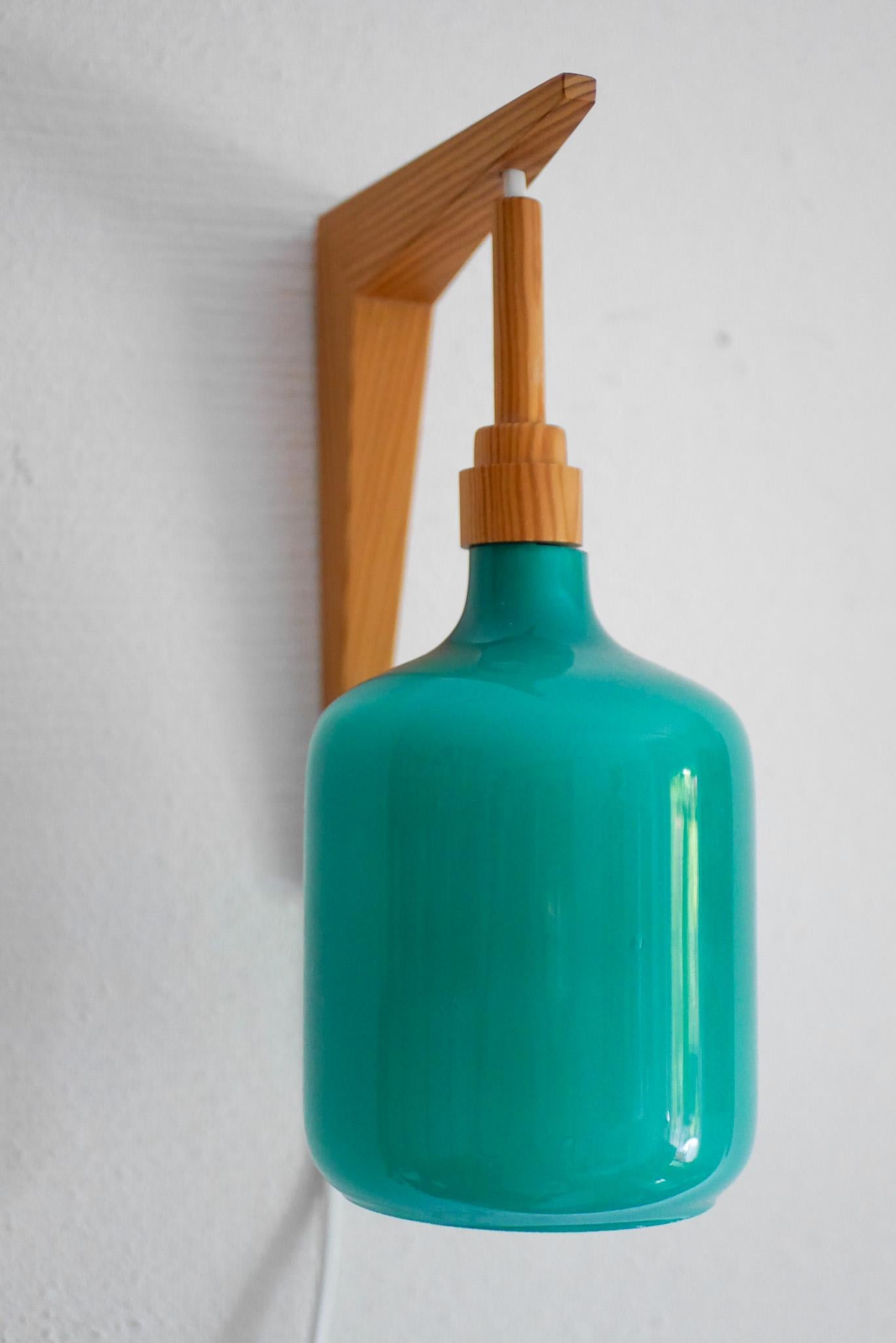 Suédois The Scandinavian 70s sconces Mid-century modern opaline glass and pine wall lights en vente