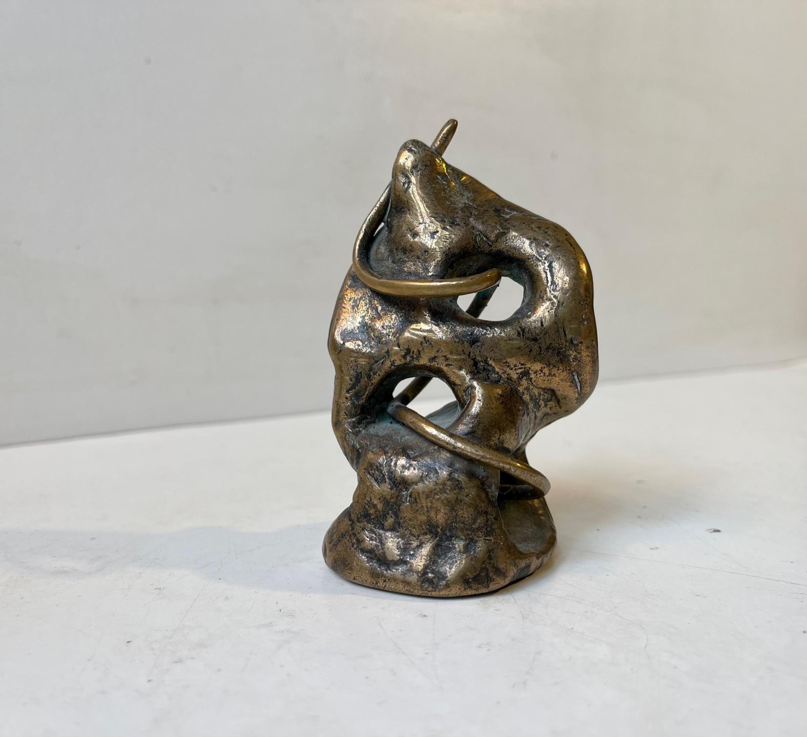 Small unusual object in cast bronze. Freeform, Infinity symbolism and barbwire all in one unique piece. Its signed by an unknown Scandinavia Sculptor and dated 1990. Measurements: H: 10, W: 6 cm, Dept/base: 5 cm.


