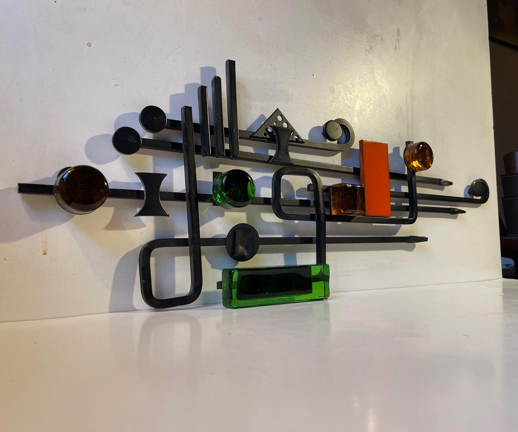 Joan Miro and Wassily Kandinsky inspired Wall sculpture made by Danish design company Dantoft kunstartikler (trans.: art objects). It is made from black lacquered and welded iron set in a graphic formation highlighted by thick green and amber yellow