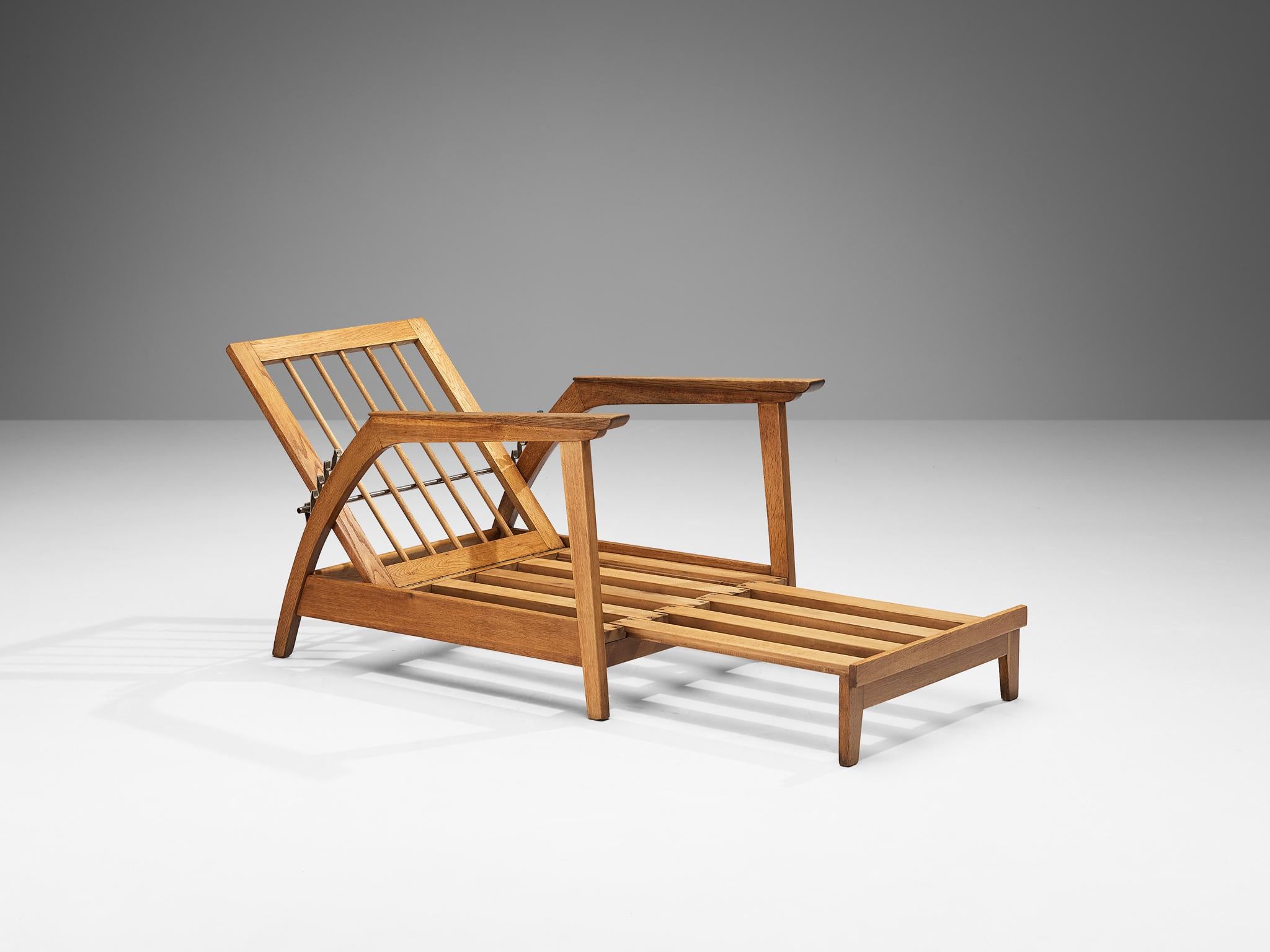 Chaise longue, oak, metal, Scandinavia, 1950s

This chaise longue is a perfect example of Scandinavian Modernism by means of its simplicity and multi-functionality. The seat of the chair can be slid outwards, turning it into a daybed. Slid