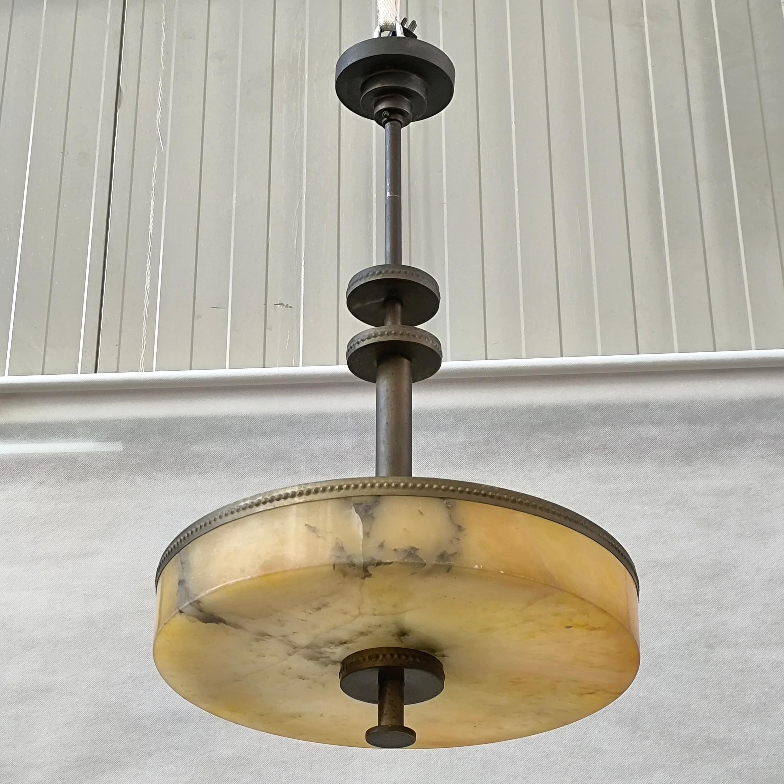 A rare and elegant ceiling fixture attributed to *Harald Notini, designed for **Arvid Böhlmarks Lampfabrik, Sweden, circa 1930s. This piece exemplifies the refined aesthetic of Swedish Grace transitioning into early functionalism, with its