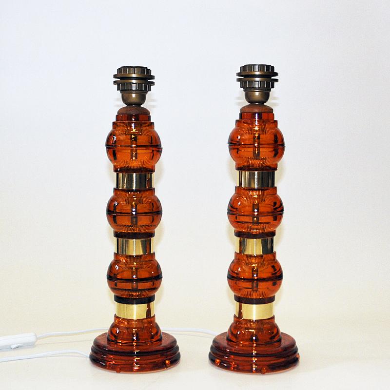 Scandinavian Amber colored glass and brass tablelamp pair from the 1960s In Good Condition In Stockholm, SE