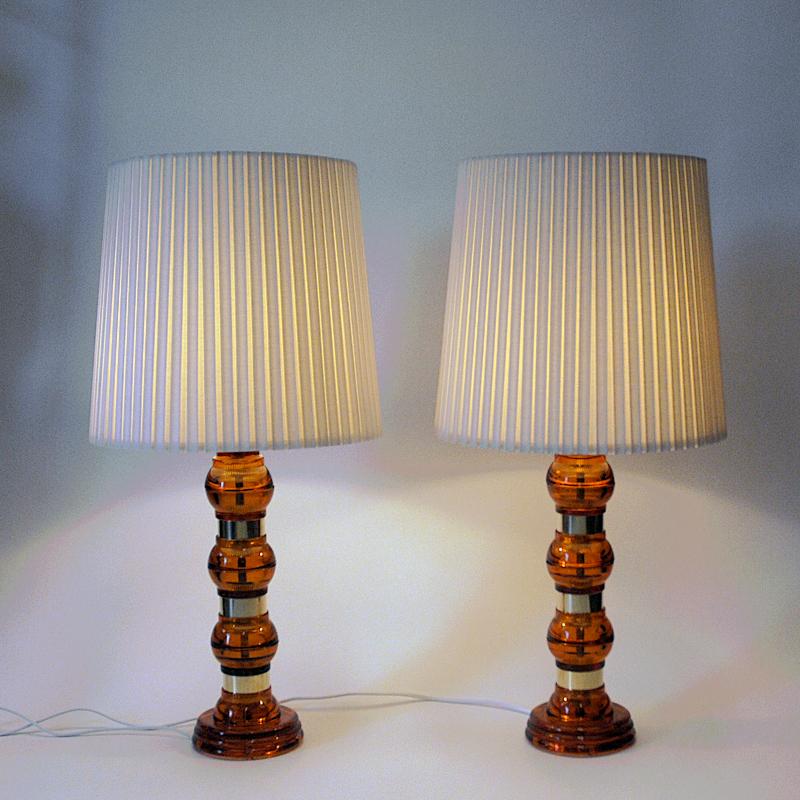 Mid-20th Century Scandinavian Amber colored glass and brass tablelamp pair from the 1960s