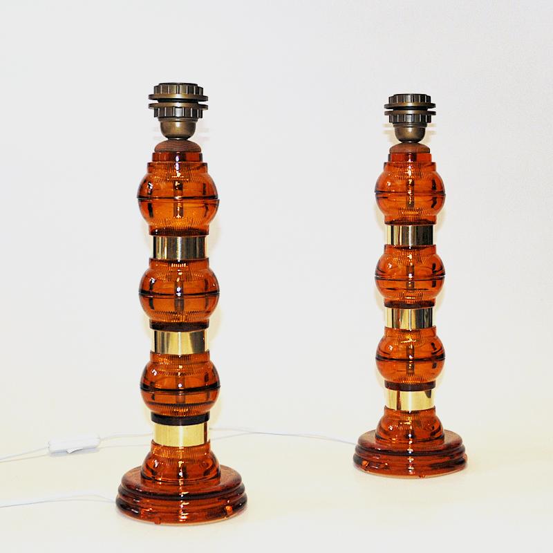 Brass Scandinavian Amber colored glass and brass tablelamp pair from the 1960s