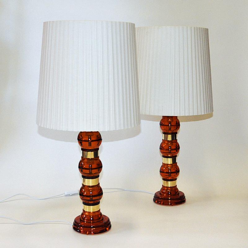 Scandinavian Amber colored glass and brass tablelamp pair from the 1960s 1