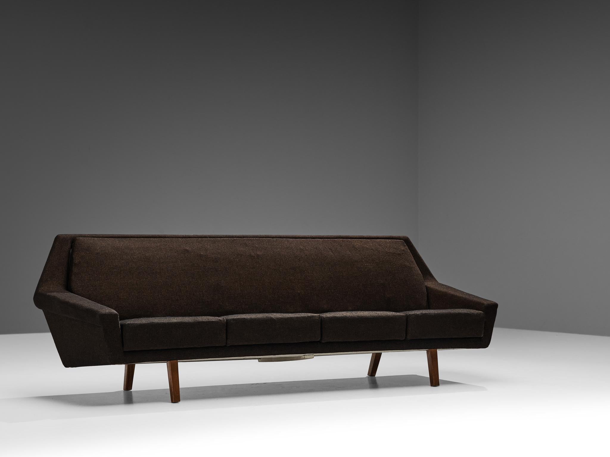 Sofa, fabric, oak, Scandinavia, 1960s

Elegant and spacious four seat sofa made in Scandinavia in the 1960s. The design of this sofa is angular and sharp in its execution. It is very balanced in its form and proportions. Four seating cushions