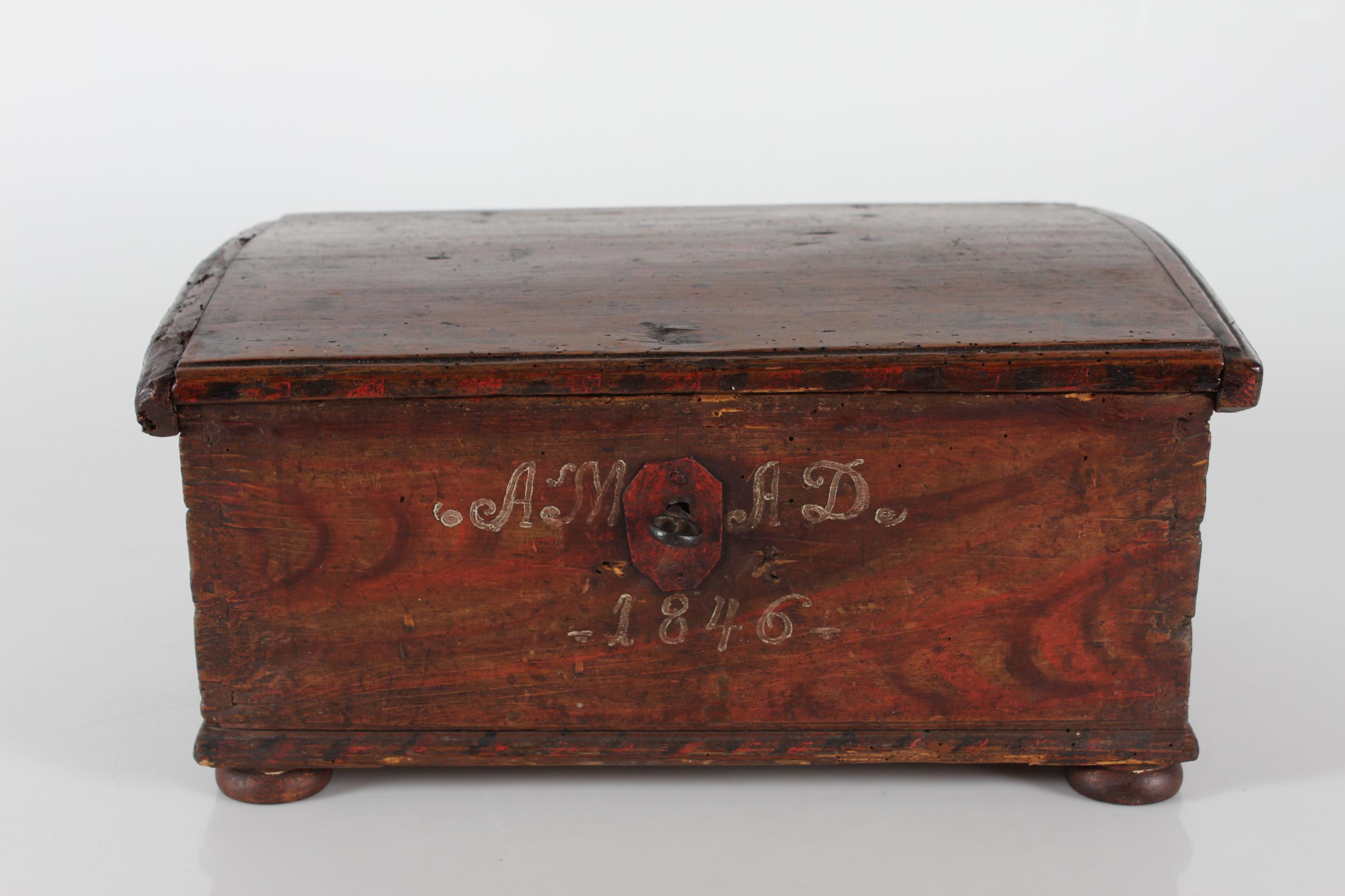 Original Scandinavian antique chest box from 1846, most likely from Sweden where we found it.

The chest box is made from pine wood and is handpainted. The paint is in warm brown shades and also illudes wood. It has worn off here and there and faded