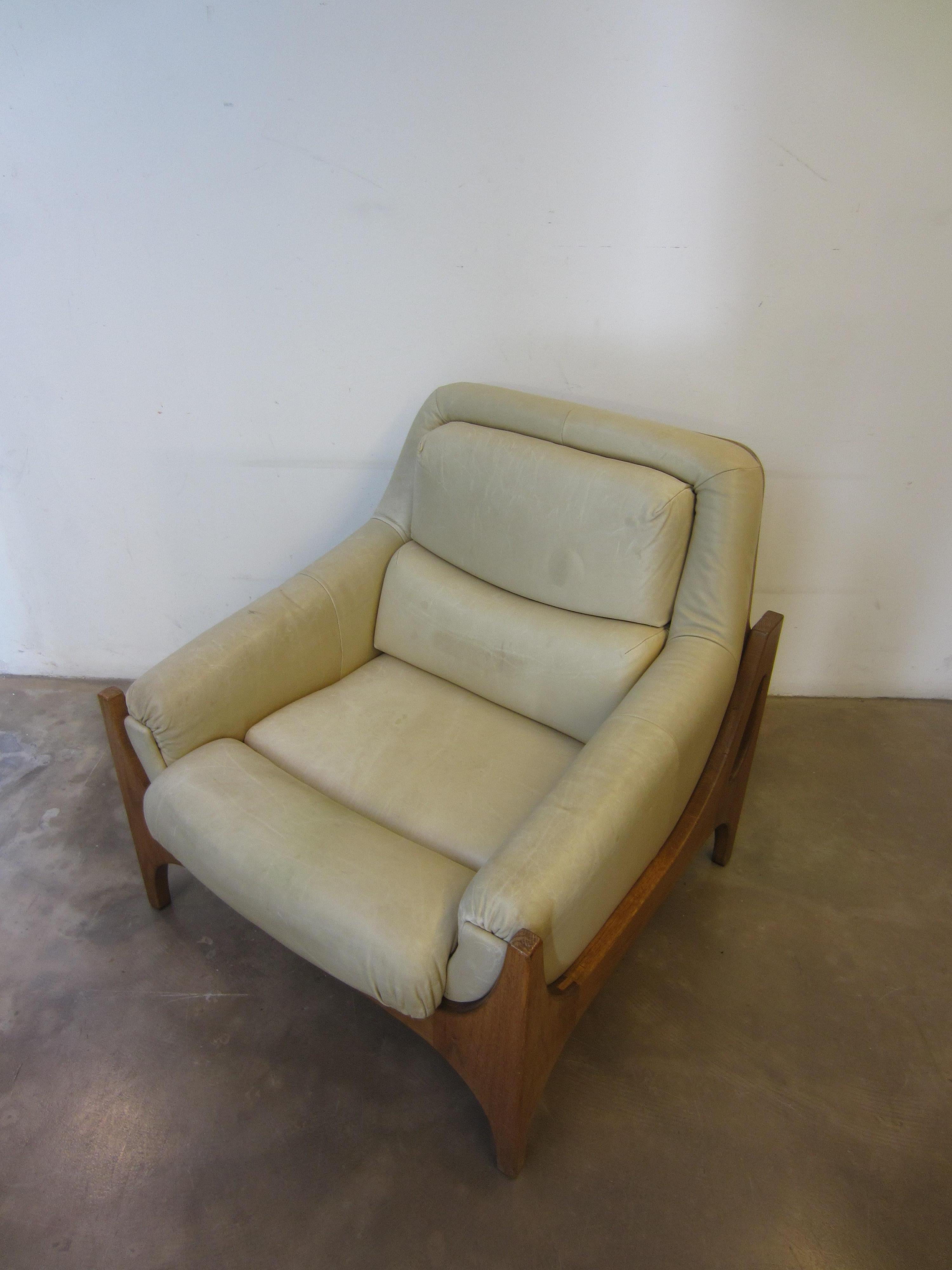Wonderful Scandinavian armchair made in oakwood and leather. 
Beautiful details in the wood joints, good condition. 

Condition: Fairly good, leather has a circle and is slightly damaged on the left side. There is damage to the wood of a back
