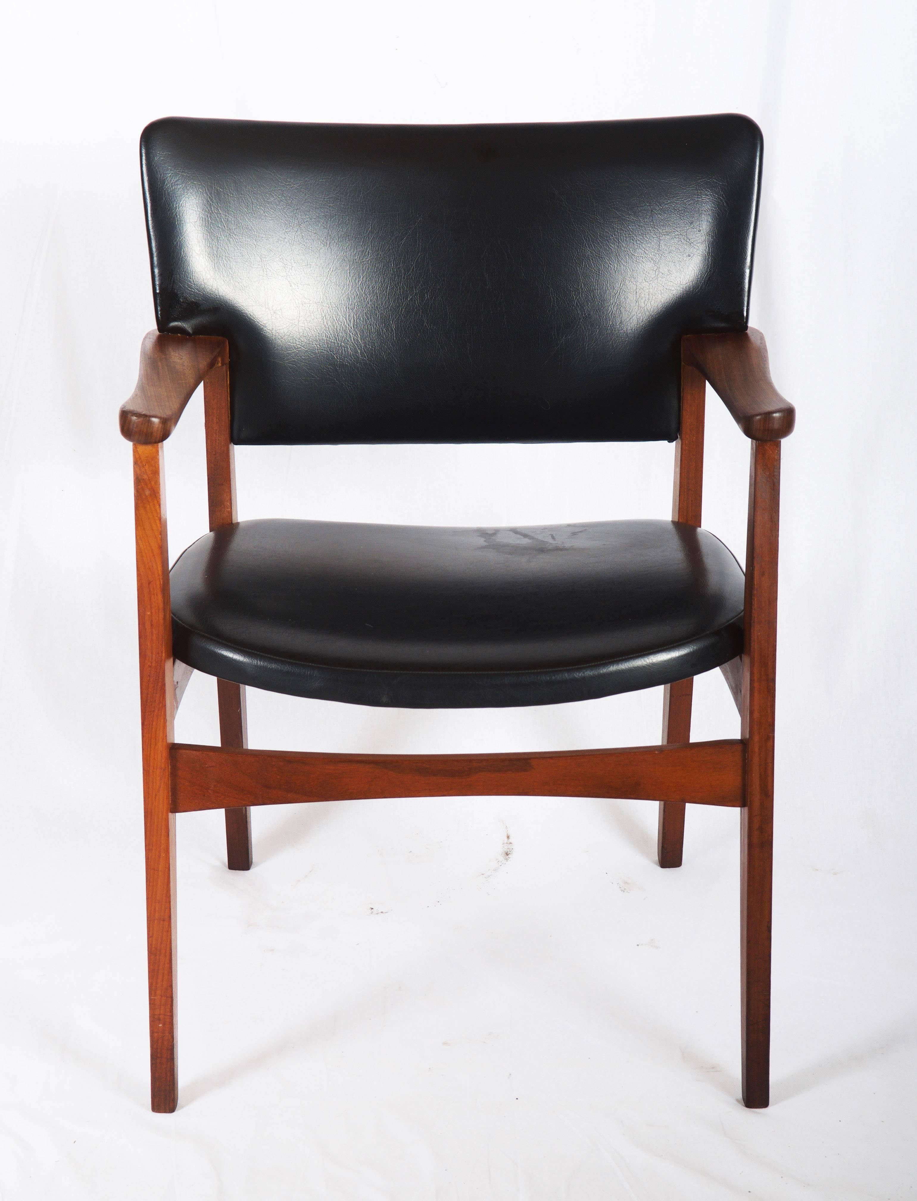 Solid teak frame with upholstered seat and backrest in black leatherette. Made in Denmark in the late 1950s. New upholstery on request possible (150$ + cost of the leather fabric)