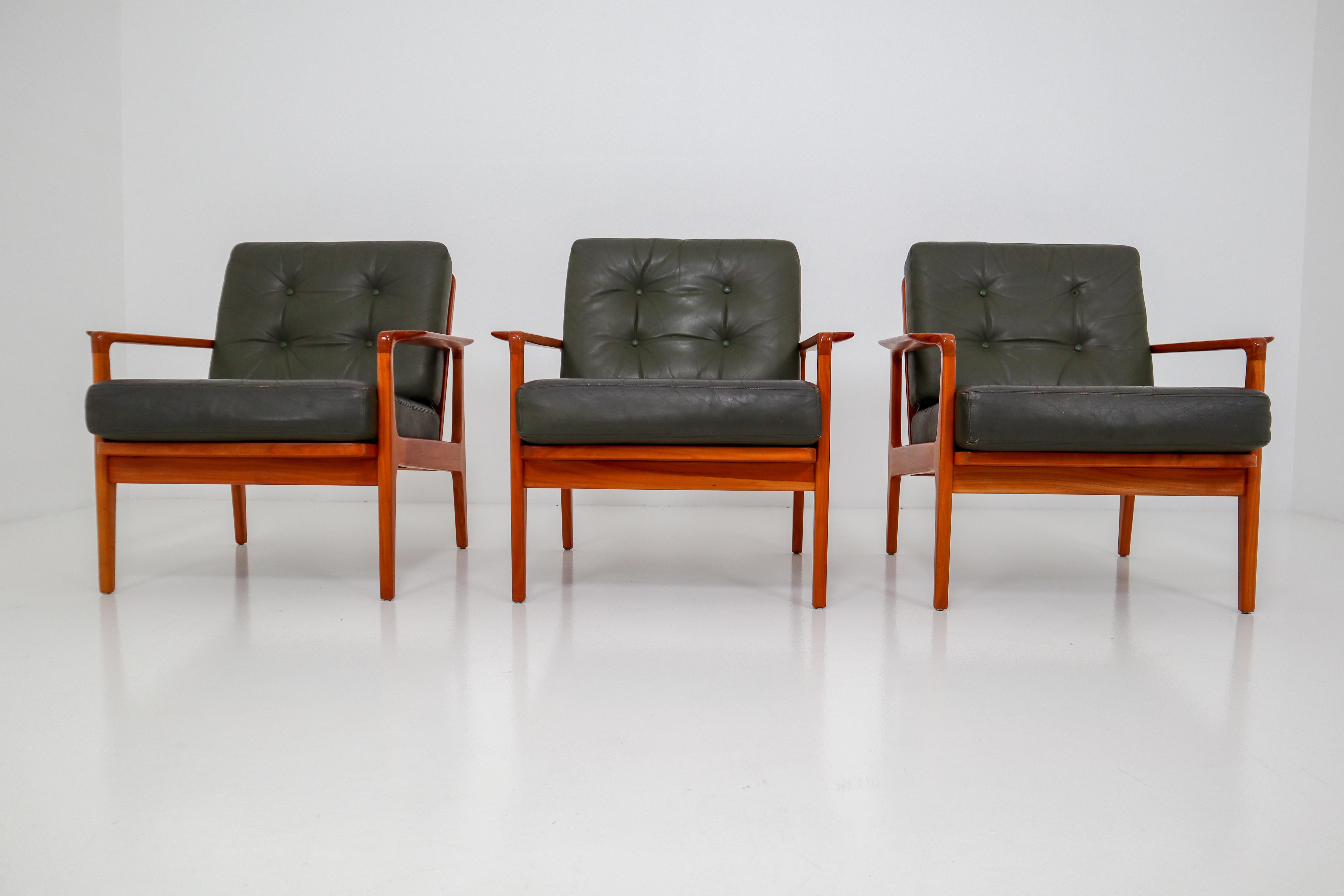 Scandinavian armchairs in fine leather, circa 1960. These beautiful armchairs have a fine wood grain and original leather upholstery with minor signs of usage and patina. A very decorative and comfortable armchair of high quality.