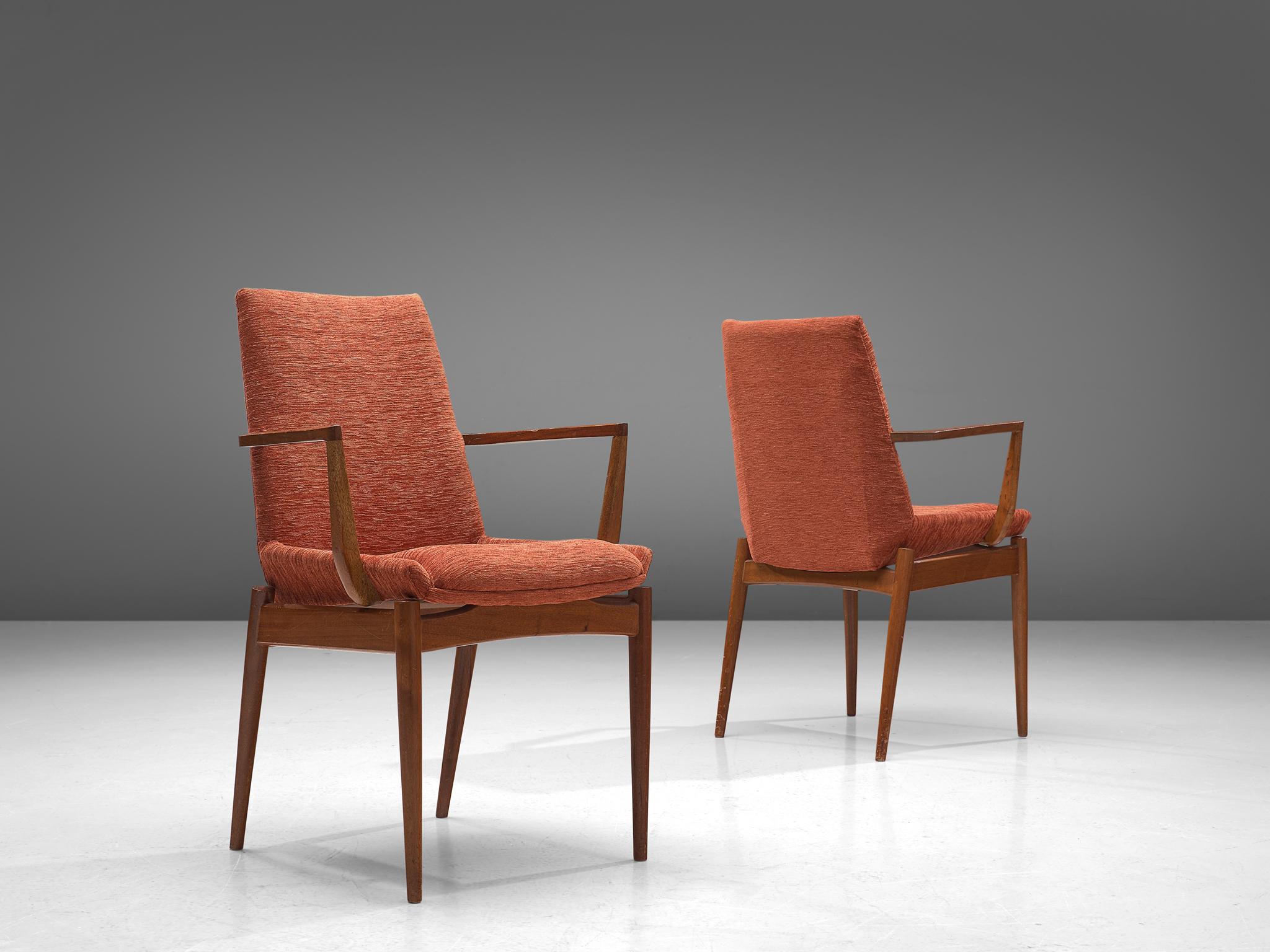 Armchairs, teak, red orange corduroy, Scandinavia, 1950s

The two armchairs are sculptural and elegant. The design features a high, sculpted back. The curved, tapered legs are another main feature of the chairs. The main feature of this set is the