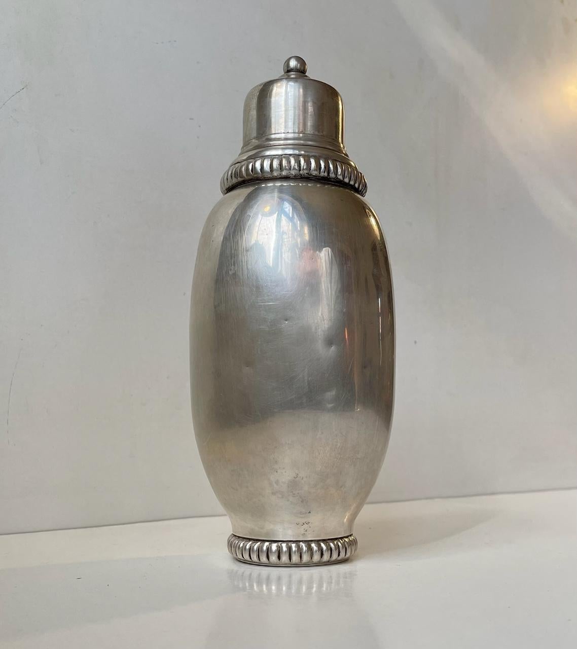 A stylish, perfectly balanced and designed shaker in polished pewter. It is stamped with a Royal Crown. Designed and made in Scandinavia, probably Sweden, during the 1920s or earlier. Measurements: height: 24.5 cm, diameter: 10 cm. Capacity circa