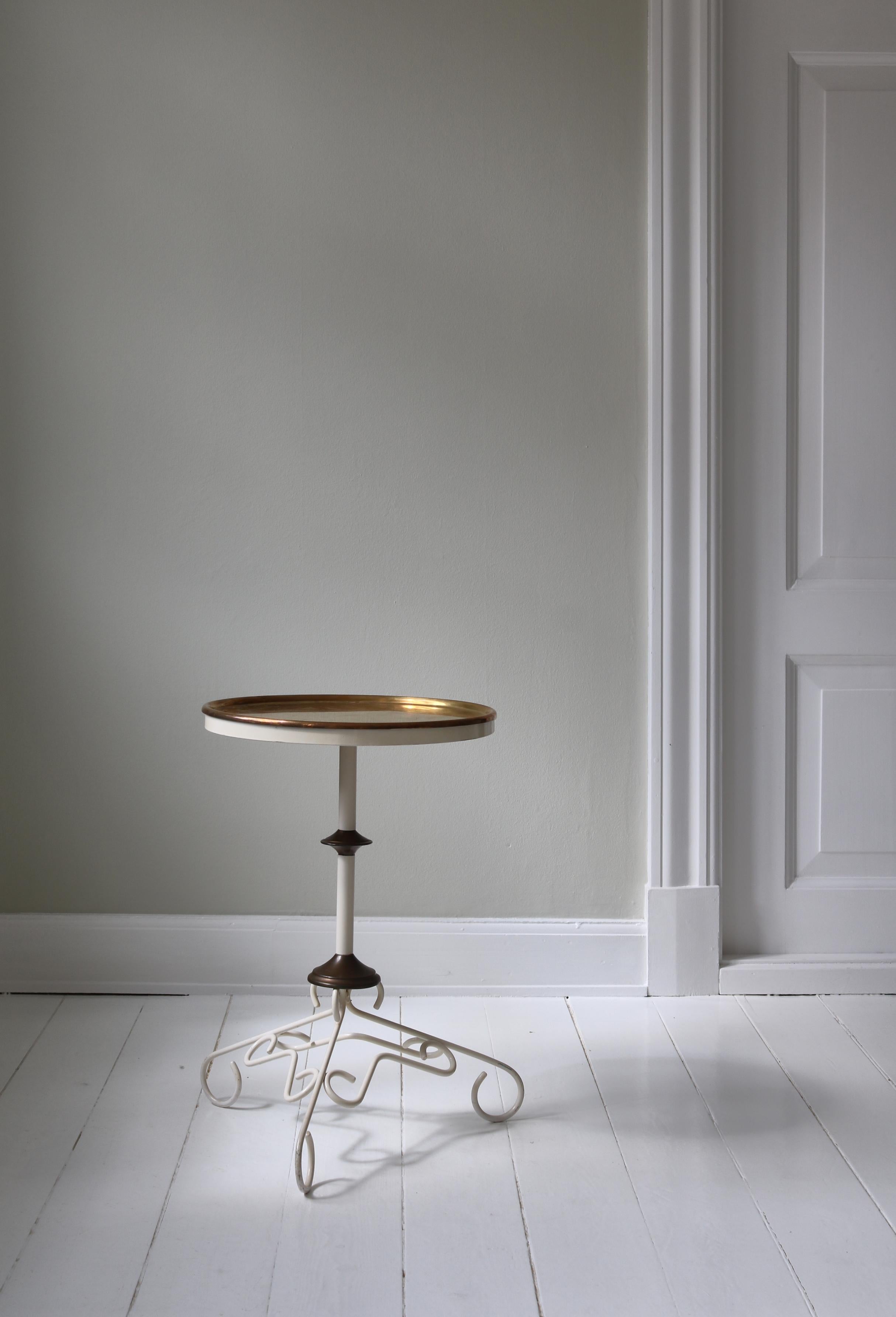 Scandinavian martini table from the 1930s in patinated brass and white lacquered cast iron. The top can be lifted off and used as a tray for drinks. Art Deco style.