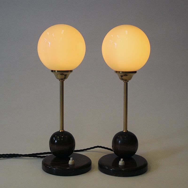 Lacquered Scandinavian Art Deco pair of table lamps with opaline glass domes 1930s