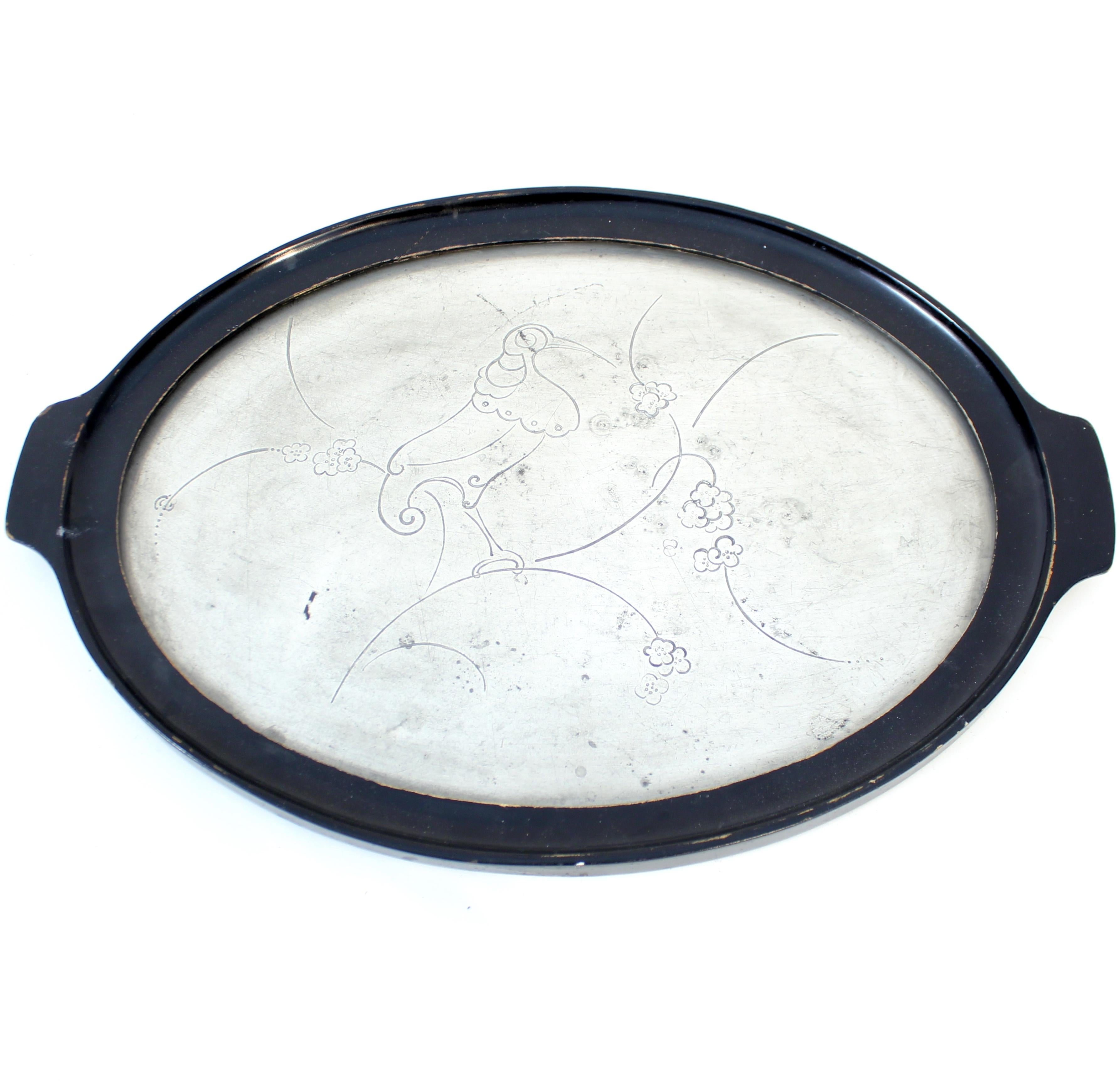 Pewter and ebonized wood tray from the 1930s by unknown maker. Most likely Swedish but for sure Scandinavian. Motif of a bird and some plants. Nice and honest untouched vintage condition with normal patina and ware. 