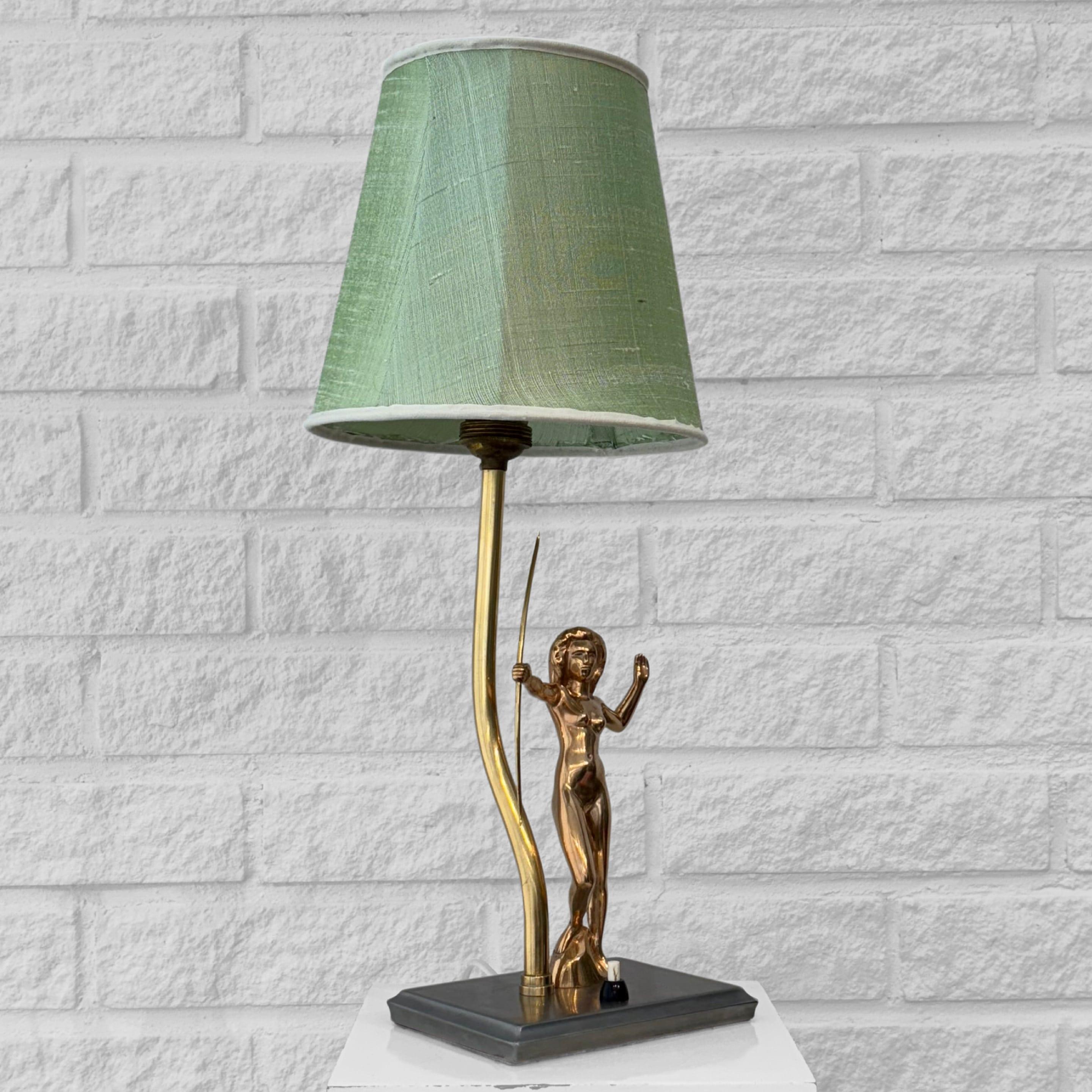 Cast Scandinavian art deco table lamp, nude female archer, brass, Sweden, 1920s For Sale