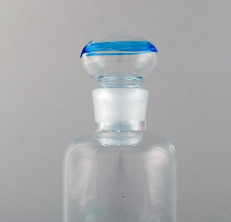Scandinavian art glass. Carafe in clear and light blue art glass, 1970s.
Measures: 25.5 x 9.5 cm.
In very good condition.