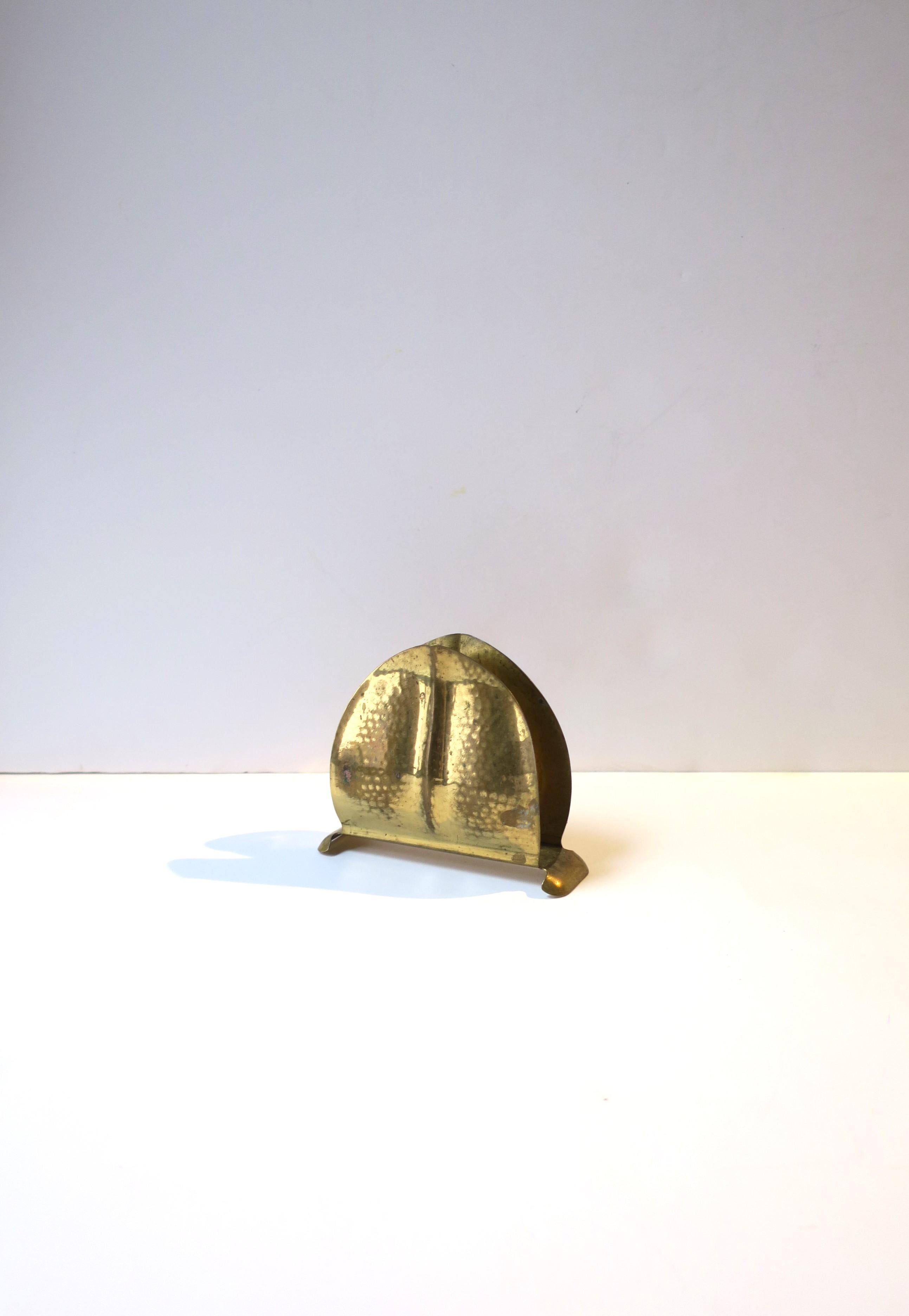 A beautiful Swedish hammered brass desk letter or napkin holder, Art Nouveau design, circa early-20th century, Sweden. Piece is hammered brass with an Art Nouveau leaf-design. Marked on underside 'Made in Sweden' as shown in last image (close-up.)