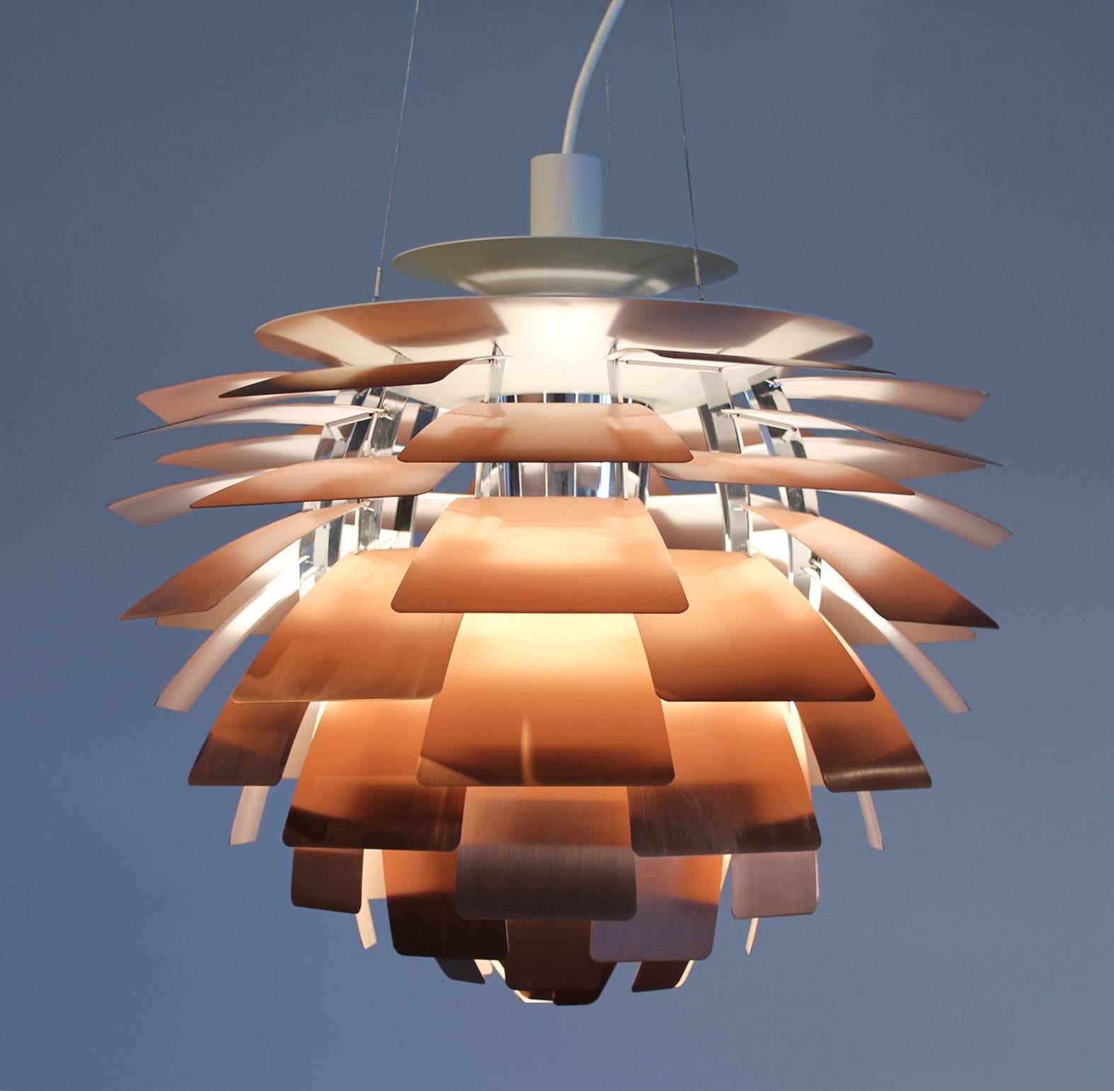 PH Artichoke pendant light designed by Poul Henningsen and made in Denmark by Louis Poulsen 1958. Constructed from Copper, enameled steel, chrome plated brass and enameled aluminium.

The Artichoke pendant chandelier was designed in 1958 for the