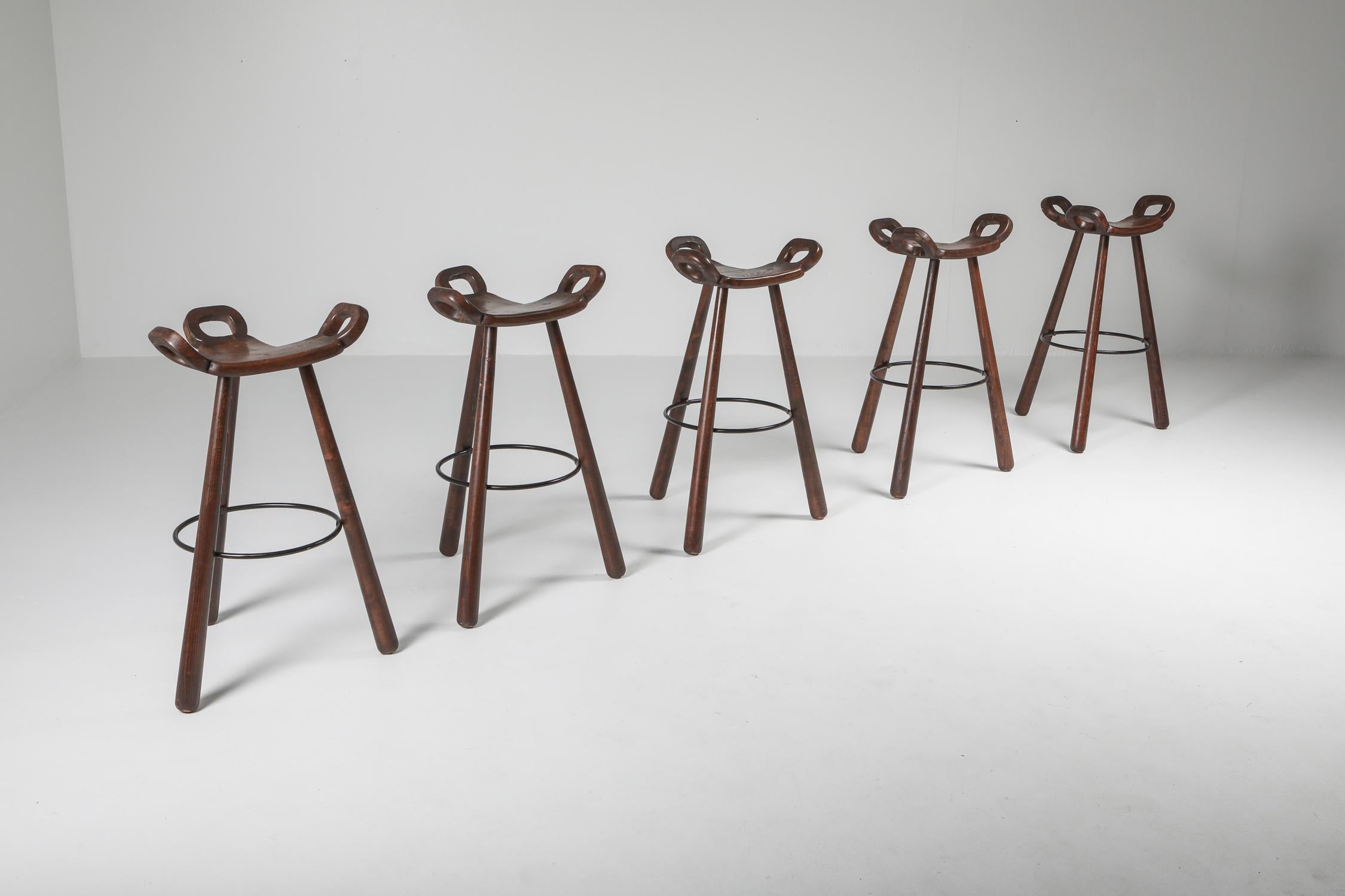 Scandinavian modern bar stools by Carl Malmsten, made in 1950s Sweden. Embodying the essence of mid-century aesthetics, these stools have a sturdy construction of solid beech wood, making them both durable and with a warm, inviting appearance.