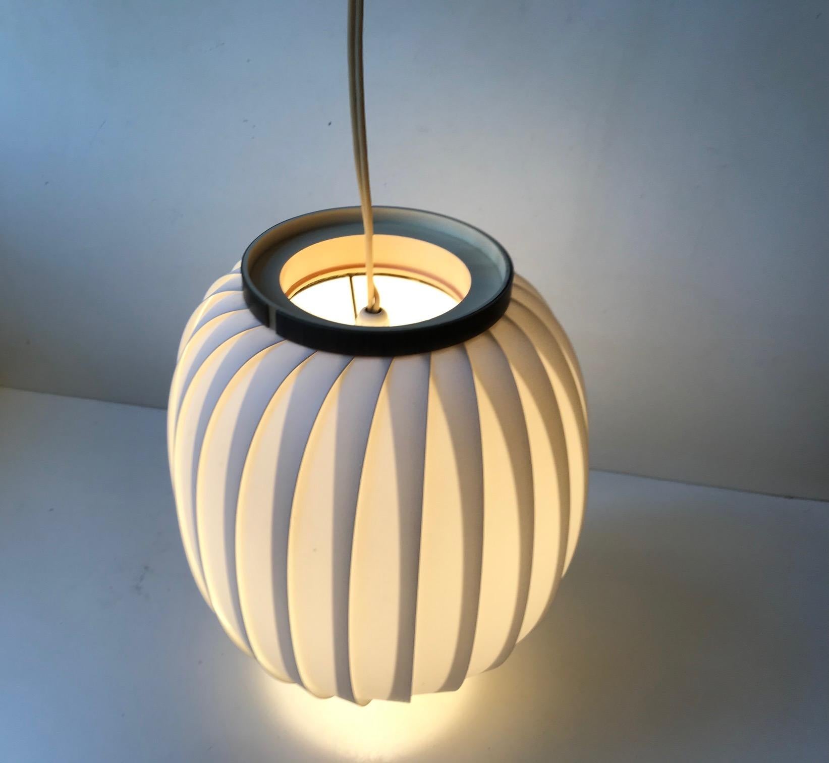 Simplistically composed white crylic pendant lamp called Bojan or Beehive. It was designed by Lars E. Schiøler and manufactured by Høyrup in Denmark during the 1960s. Similar designs surfaced from Le Klint and Heifetz Rotaflex some years later.