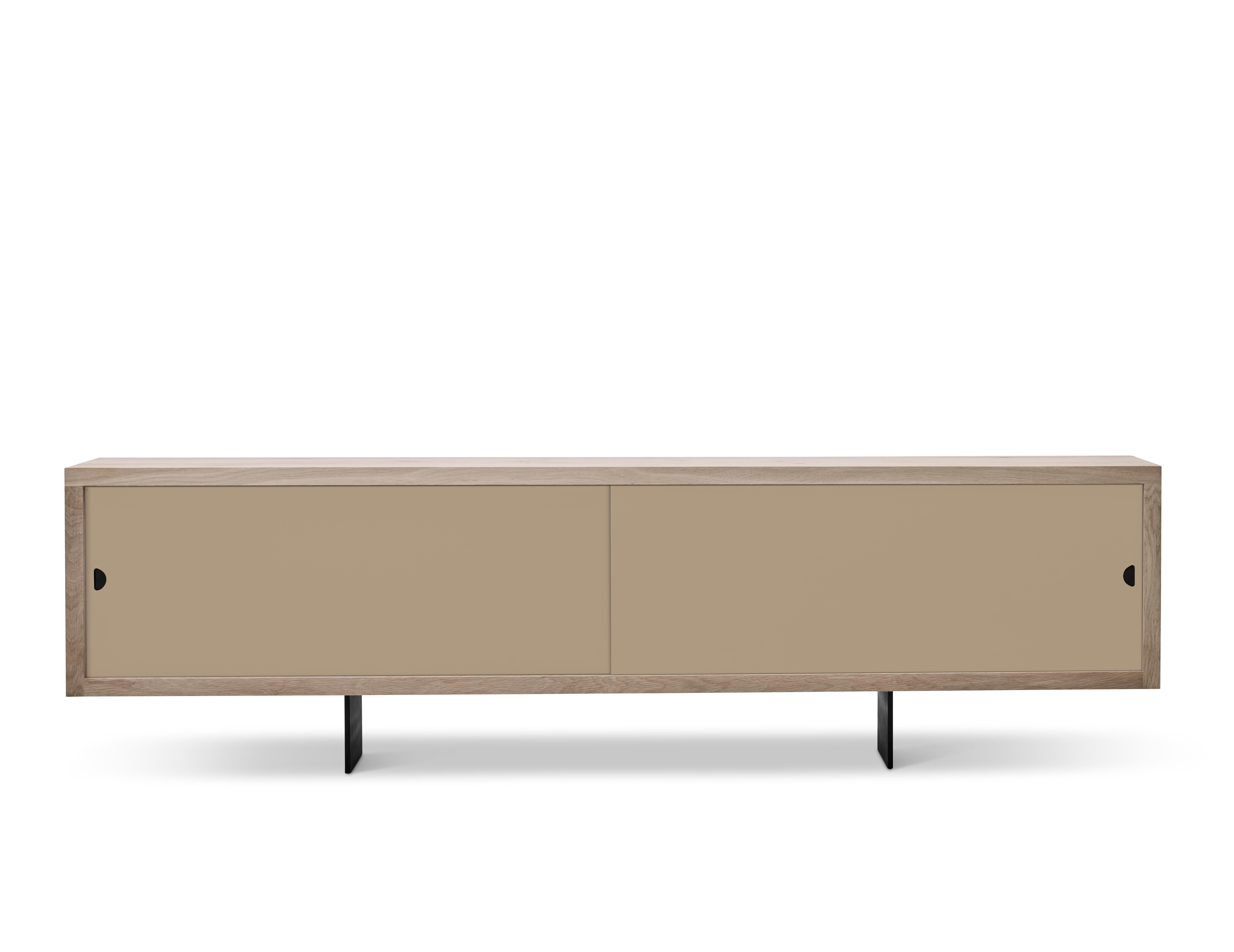 GRAND Sideboard by Jacob Plejdrup for DK3, 2016

Sideboard with sliding doors, available in castoro, beige, black or white.
Model in the picture: Beige
Dimensions: H 68 x 50 x 200

---
dk3 is known for the large plank tables, so it was