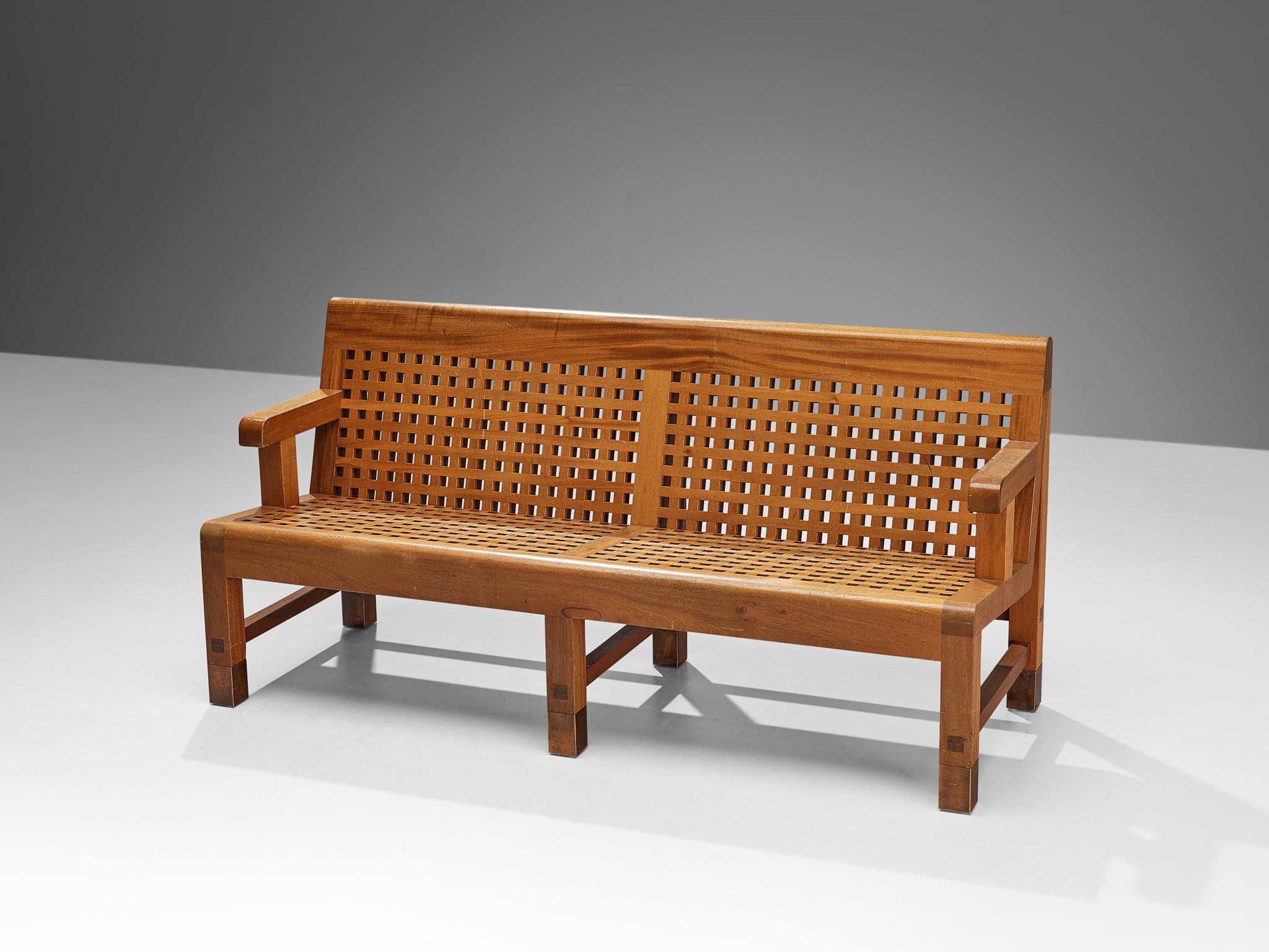 Bench or sofa, mahogany, copper feet, Scandinavia, 1950s

Interesting Scandinavian bench build up from laths in mahogany. This bench was made in the 1950s and shows very beautiful detailing, for instance the copper 'feet' on the legs of the bench.
