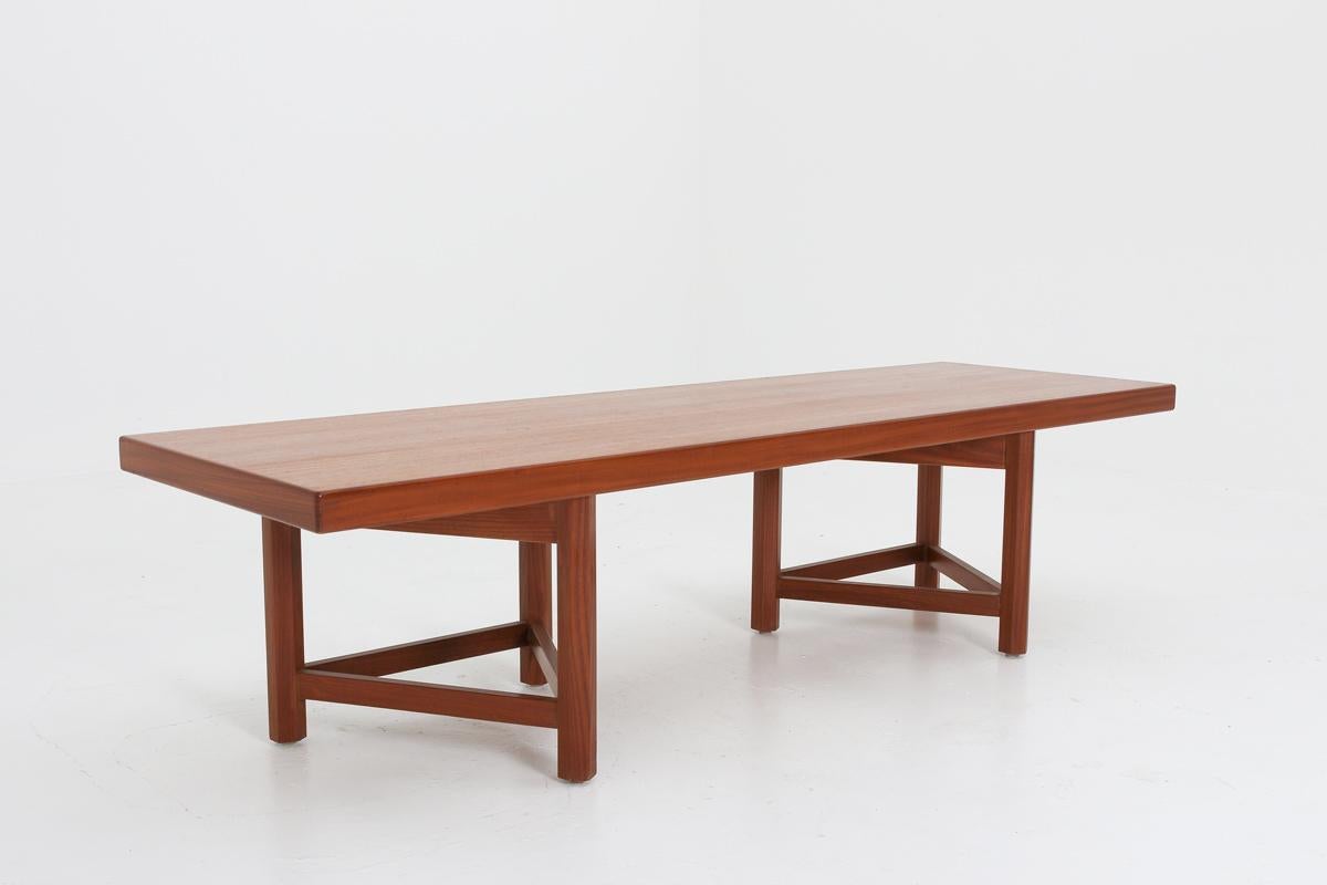 Bench designed by Carl Gustaf Hiort af Ornäs for Gösta Westerberg Möbel AB, circa 1957.
The top is made of solid wood with teak veneer and rests on triangle shaped legs in oak.
Condition: Very good original condition with minor dents and signs of