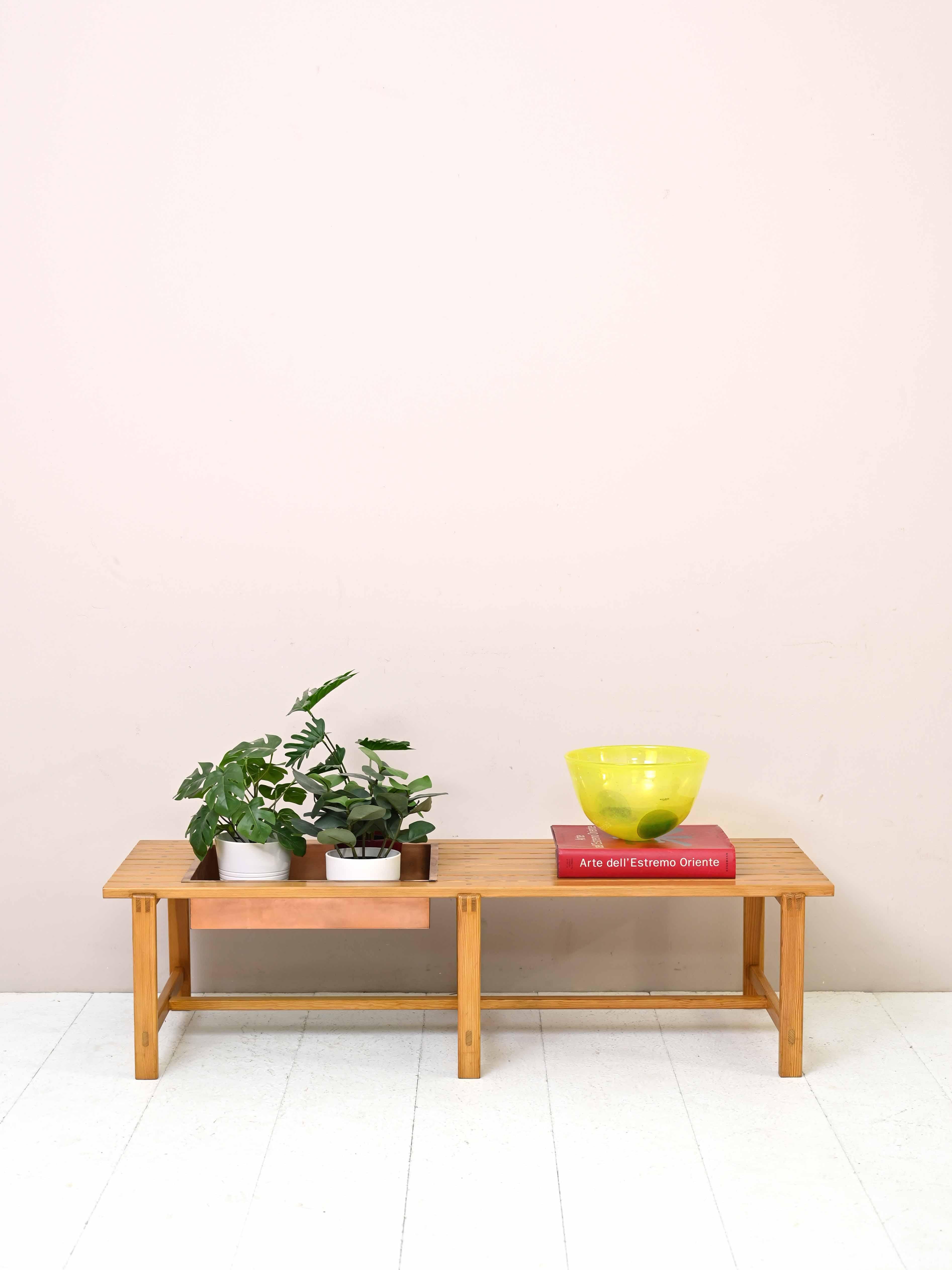 Vintage 1960s wood and metal bench.

A distinctive and typically Nordic design piece, this pine wood indoor bench has a dedicated metal planter space where plants and flowers can be placed.
Ideal to place under a window to recreate a relaxing