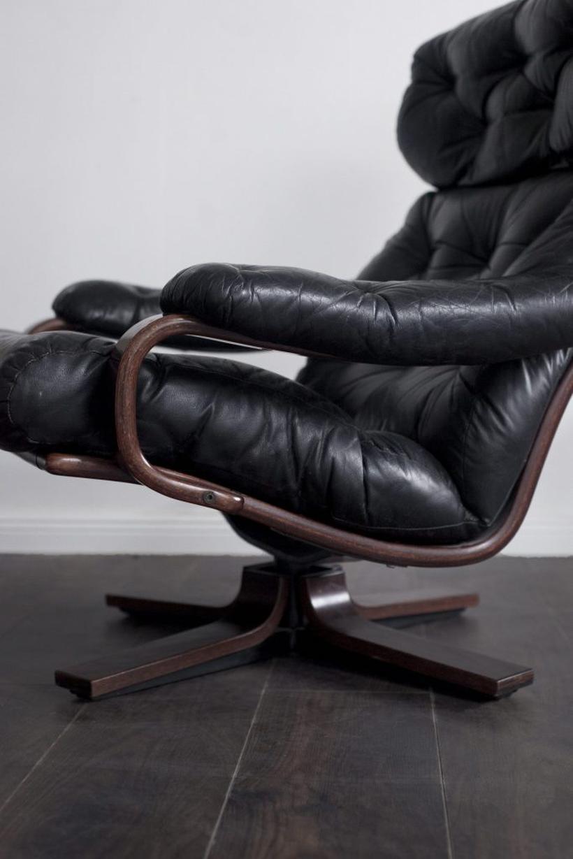 Scandinavian leather armchair with swivel function. Perfect addition to any home, office, lounge area or lobby. Ultimate spot to relax, sit back, and unwind. 

High quality leather with wood frame makes this chair look like an art piece itself.