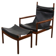 Sedia lounge Safari in pelle nera scandinava con pouf