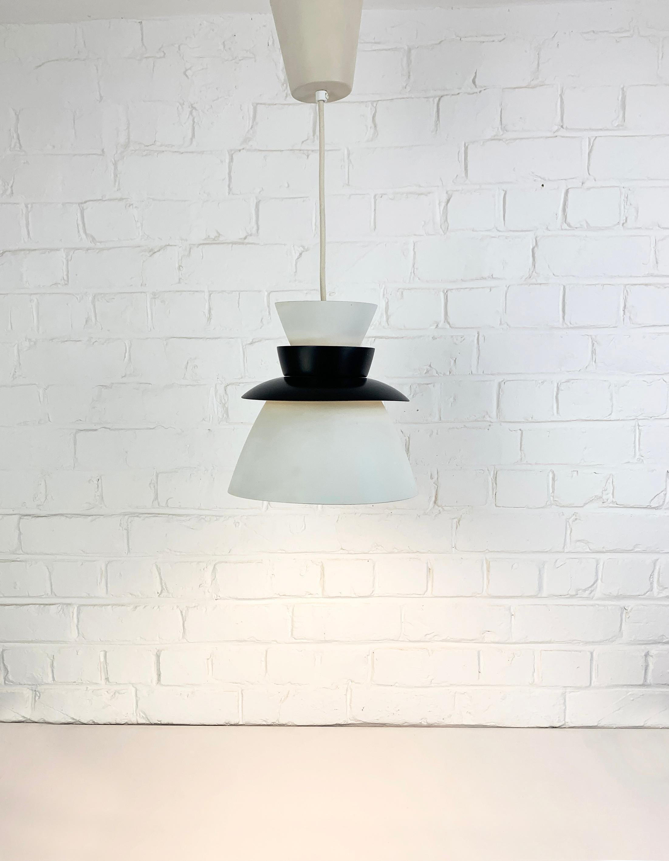 Pendant Lamp Model U336, a beautiful example of Nordic / Scandinavian Modernism. Renowned danish architect and designer Jorn Utzon, designed this beautiful ceiling pendant for Artek Finland in 1957. 

At the same time he was deeply involved with the