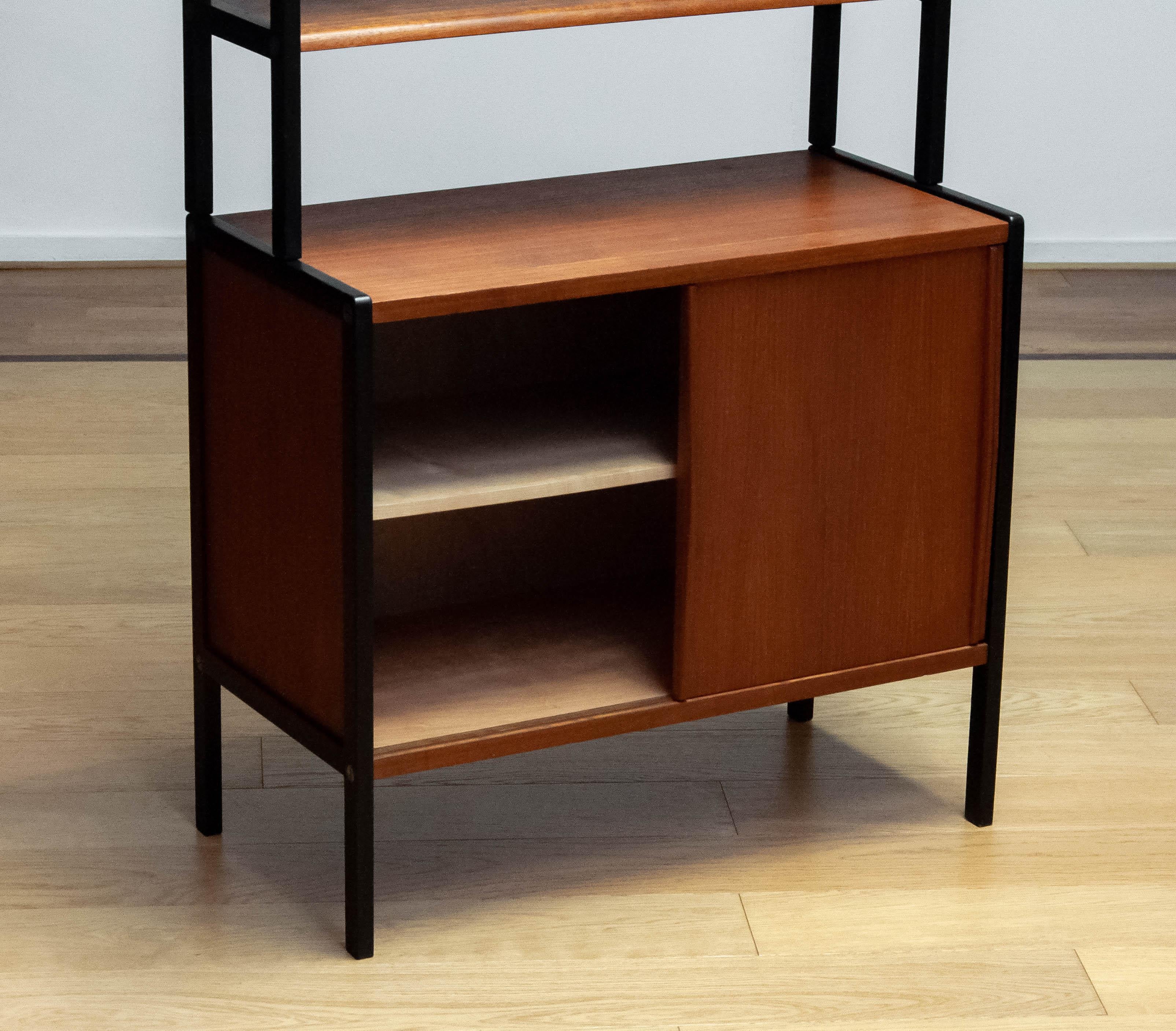 Swedish Scandinavian Bookcase In Teak With Black Lacquered Stands By Bertil Fridhagen 