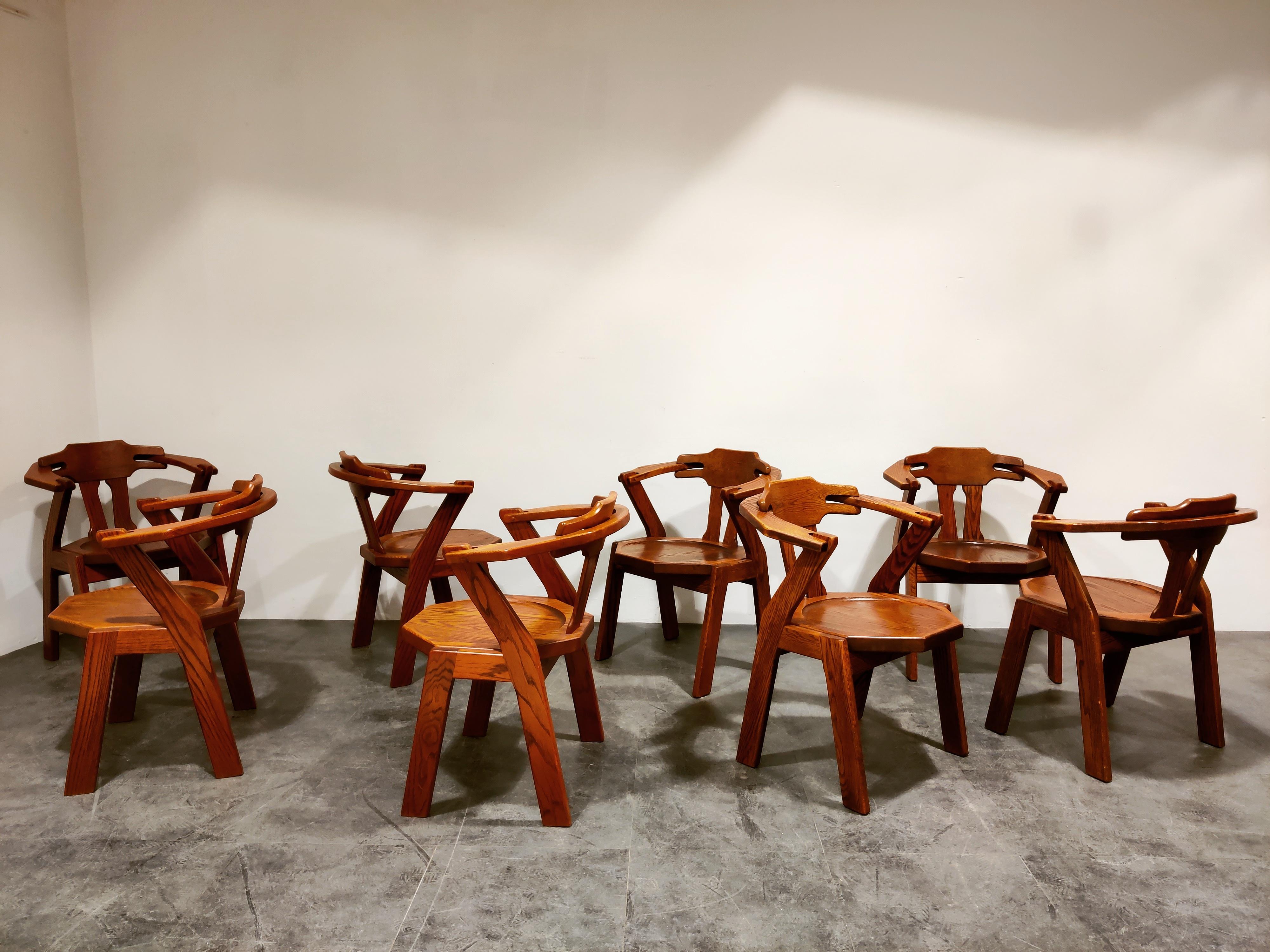 Set of 8 unique Scandinavian oak dining chairs.

Unusual design with interlocking armrests.

Brutalist style.

Timeless and can be combined in lots of interiors.

Very good condition.

1960s, Scandinavia (Denmark?)

Dimensions:
Height