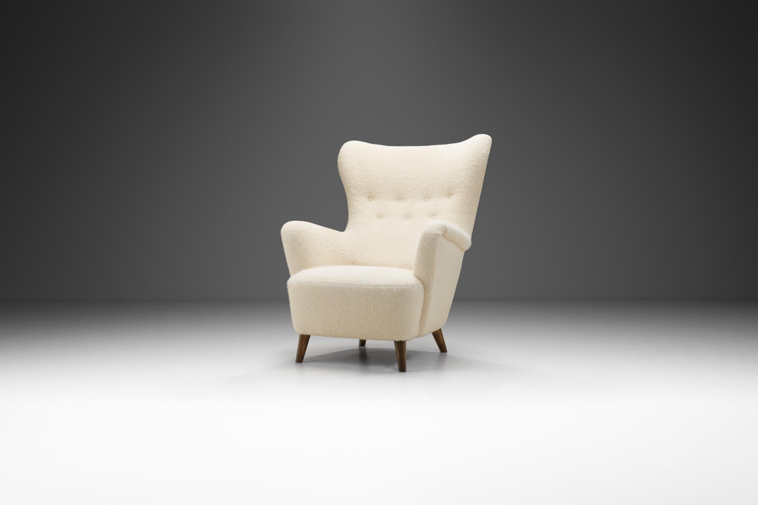 Scandinavian Modernism can be visually described by this beautiful armchair: sleek, organic and timeless. These attributes are met with high quality materials and the famous craftsmanship of Scandinavian cabinetmakers.

This curved armchair’s