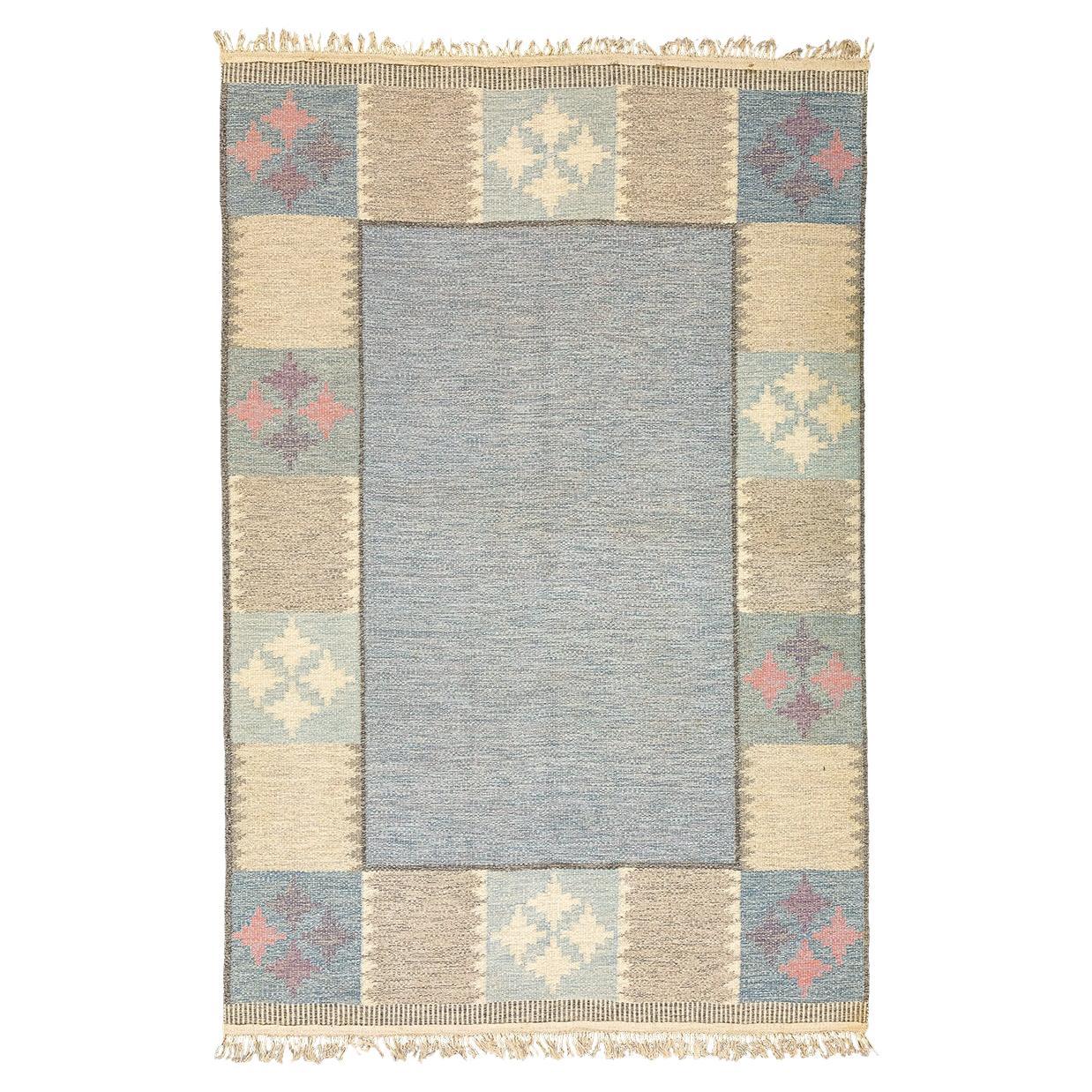 Tapis scandinave Rollakan au design minimaliste et à la palette de couleurs douces