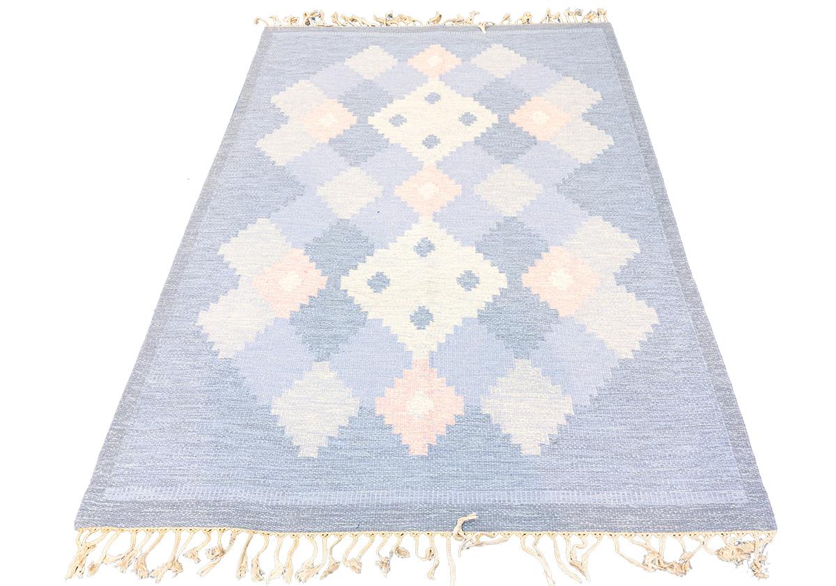 Are you looking for a Scandinavian Carpet, timeless addition to your home? Look no further than the Rollakan Swedish Rug! This rug features a muted color palette and minimalist design that will blend perfectly into any living space. Its soft texture