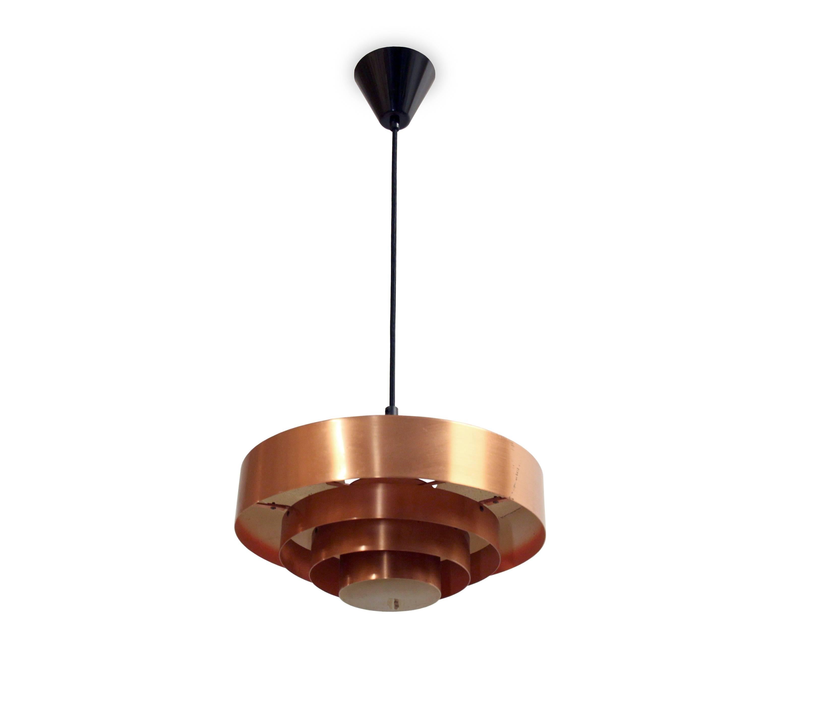 Wonderful ceiling lamp in massive copper. Designed by Jo Hammerborg and made in Denmark by Fog & Mørup from 1957. The lamp is fully working and in excellent vintage condition.