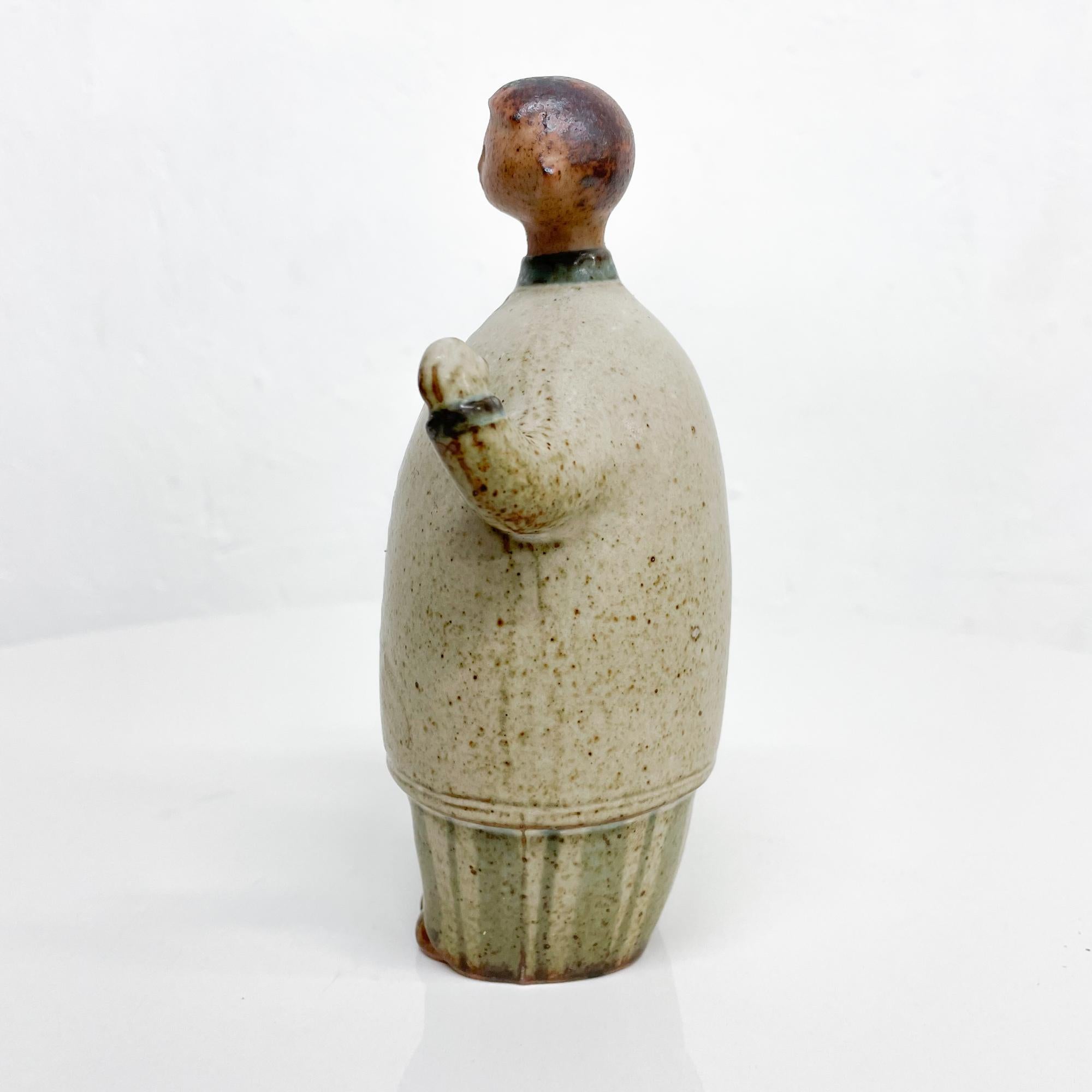 Ceramic pottery figures. His and hers figures are carefully crafted. 
Unmarked, no label present. 
Work is consistent with Scandinavian pottery, attributed in style to Lisa Larson. 
Dimensions: 6.5