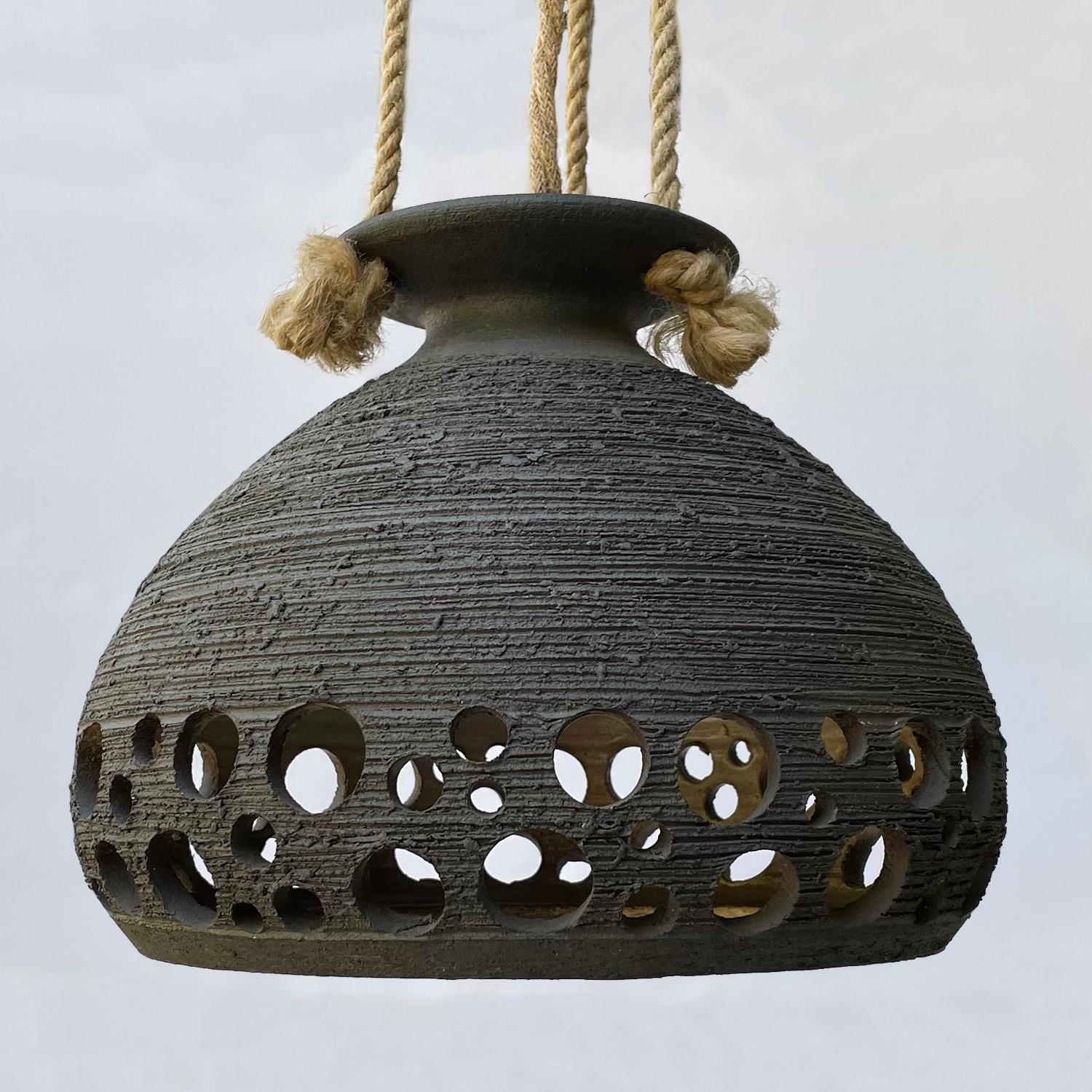 Scandinavian ceramic rope pendant light
Sweden, 1970s
Textured ceramic globe and canopy are the most beautiful shade of blue gray
Newly rewired with jute covered wiring to match the original rope detail
Single socket medium base
This is a