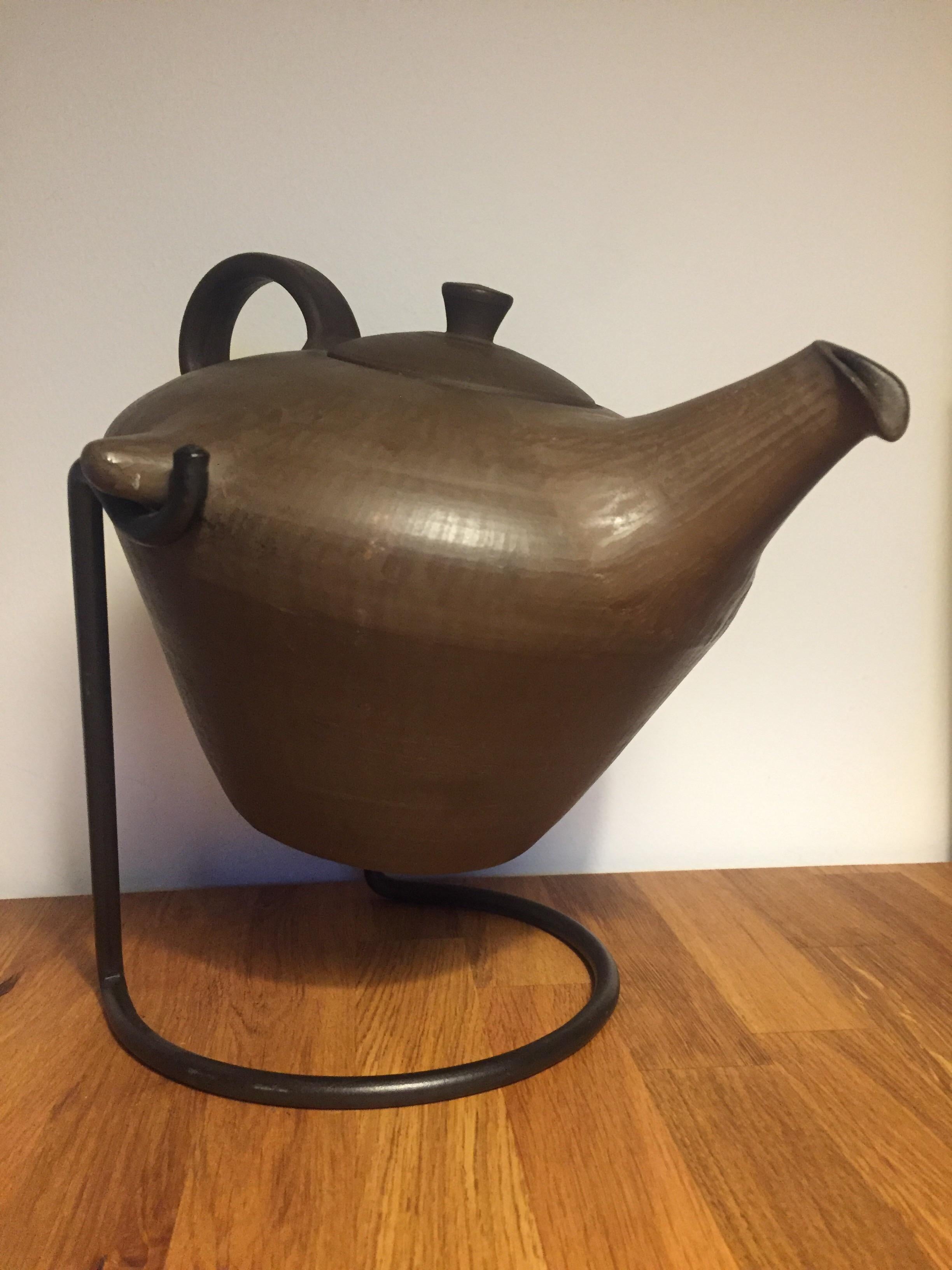 Scandinavian ceramic teapot with smaller minor structural damages but still in full working condition.