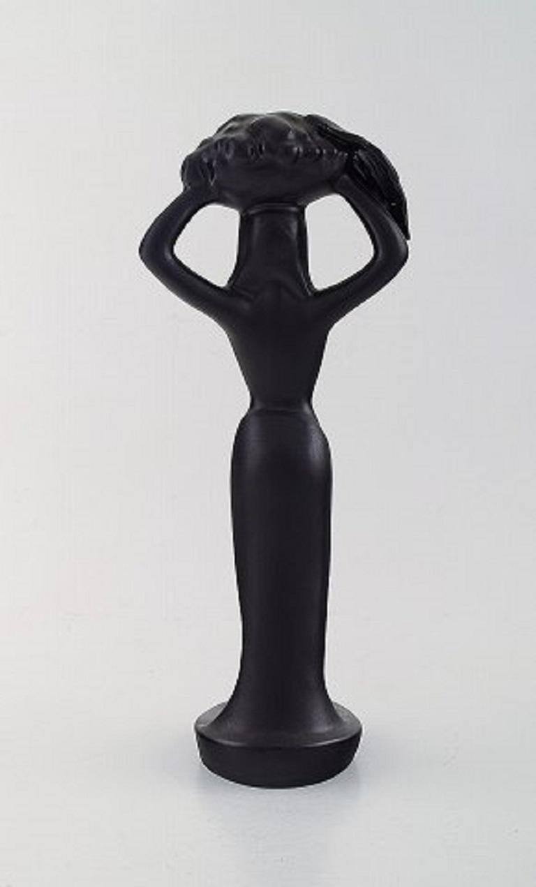 Scandinavian Modern Scandinavian Ceramist, Sculpture in Black Glazed Ceramics, Woman Carrying Basket For Sale