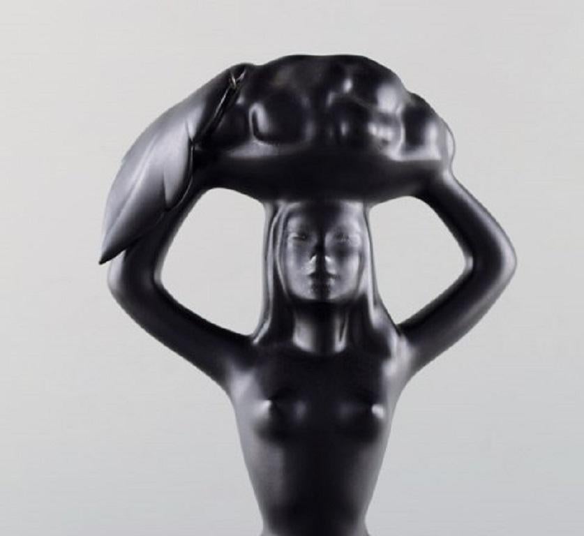 Scandinavian Ceramist, Sculpture in Black Glazed Ceramics, Woman Carrying Basket In Good Condition For Sale In Copenhagen, DK