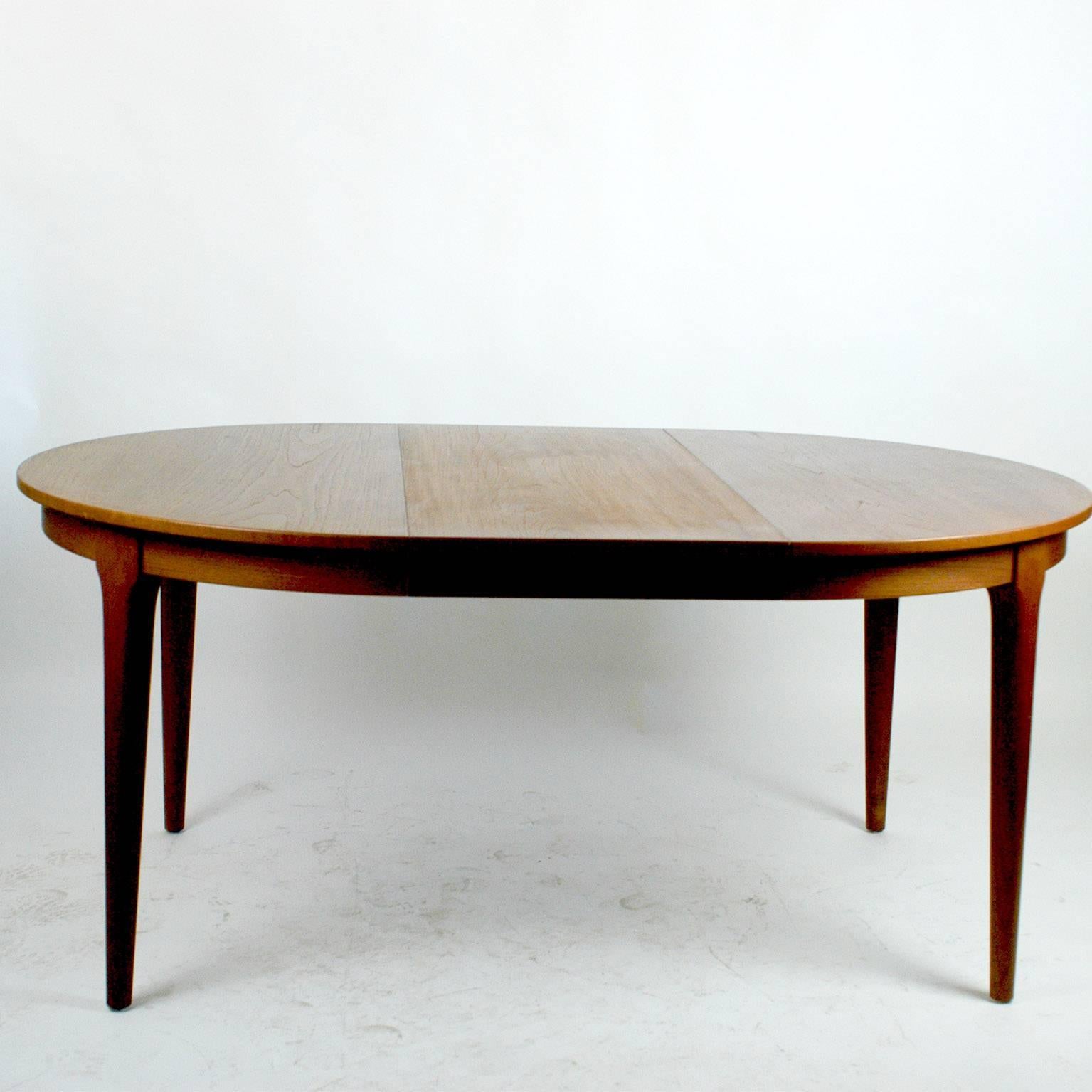 Excellent handcrafted extendable Danish teak dining table for up to eight persons. Manufacturers mark on the ubderside.