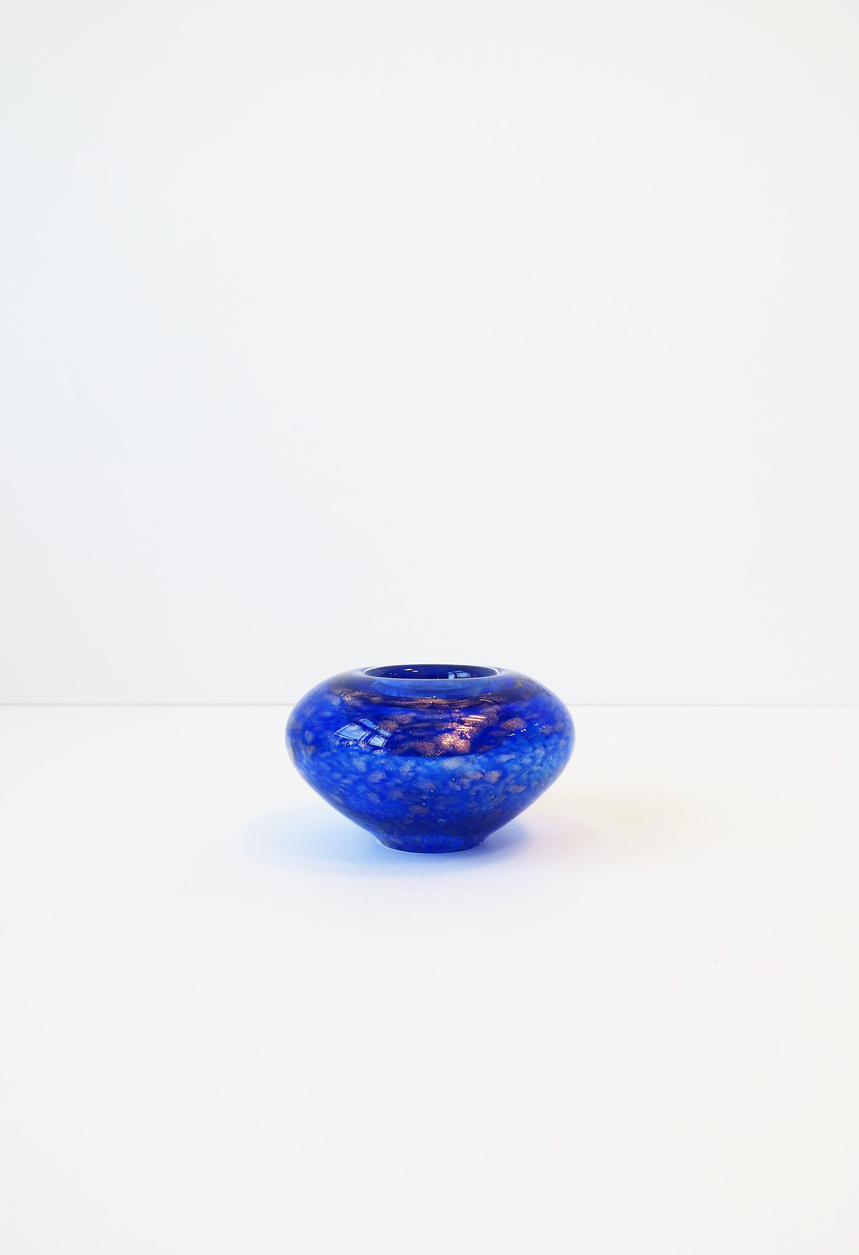 A beautiful Scandinavian Modern style royal or cobalt blue and shimmering copper art glass votive candle holder from Finland. Marked made in Finland. 

 