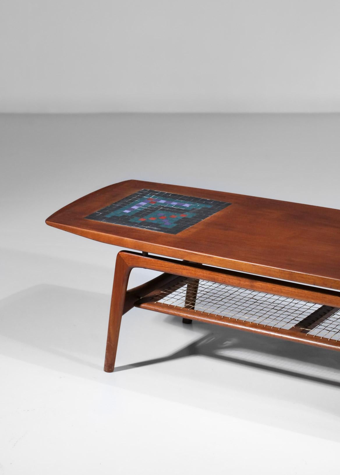 Scandinavian 60's coffee table by Danish designer Arne Hovmand Olsen for Mogens Kold. Structure in solid teak and veneer, inlaid with a ceramic mosaic on the top of the tabletop resting on a nice solid teak base quite typical of the Scandinavian