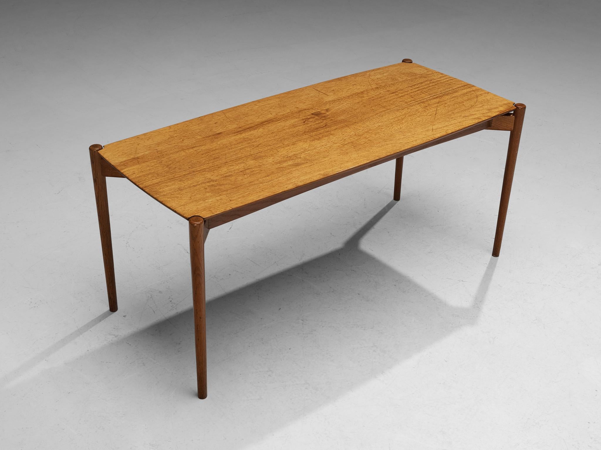 Coffee table, oak, mahogany, Scandinavia, 1960s

The design shows a strong and solid construction. This is realized by the sharp and clear lines which are visible in the rectangular top. The elegancy of the table is achieved through the elongated,