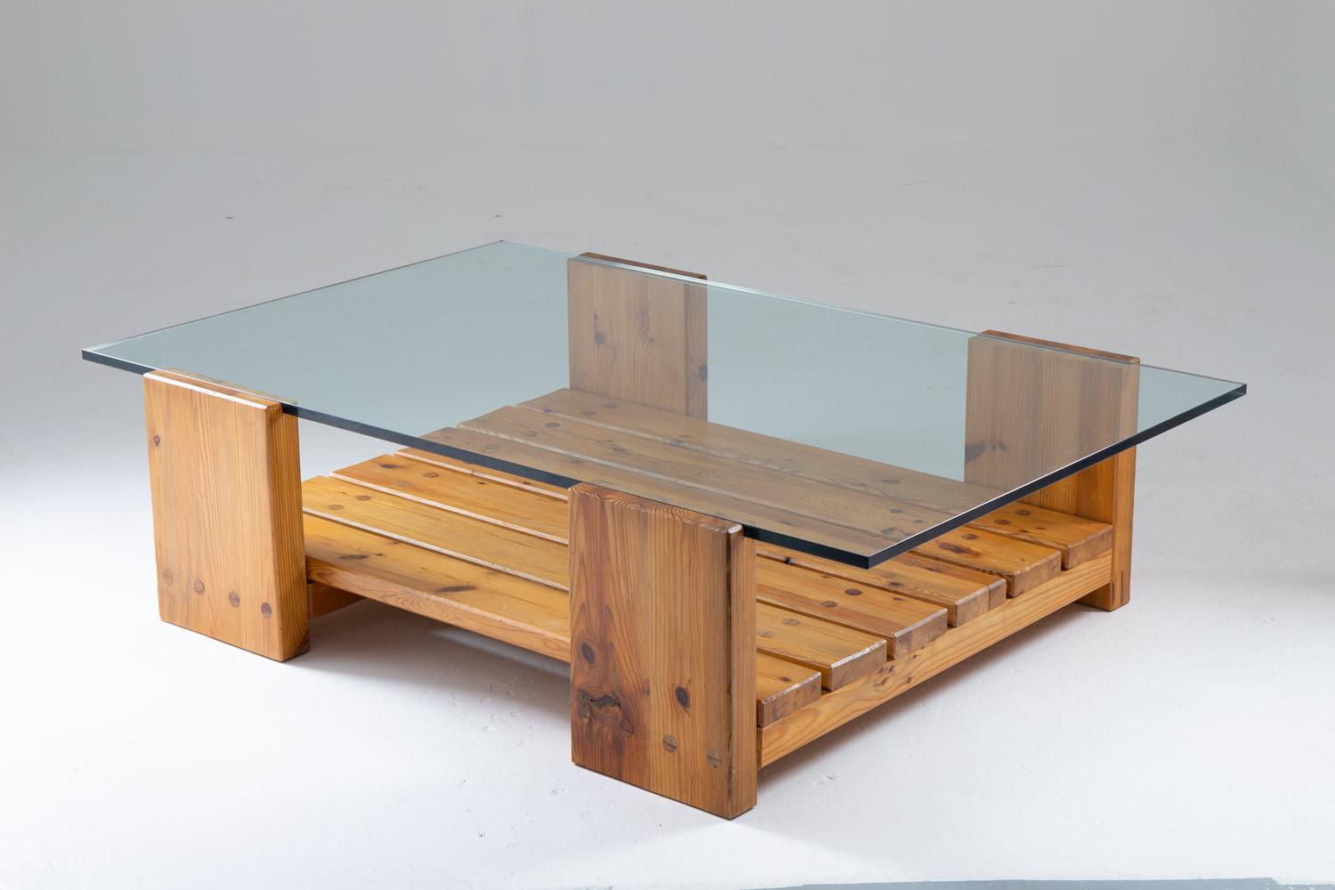 Rare coffee table in pine and glass by Sven Larsson, Sweden, circa 1970. 
This table is a great example of the robust pine furniture era that grew popular in Sweden in the late 1960s. The table consists of a thick glass plate, resting on a frame in